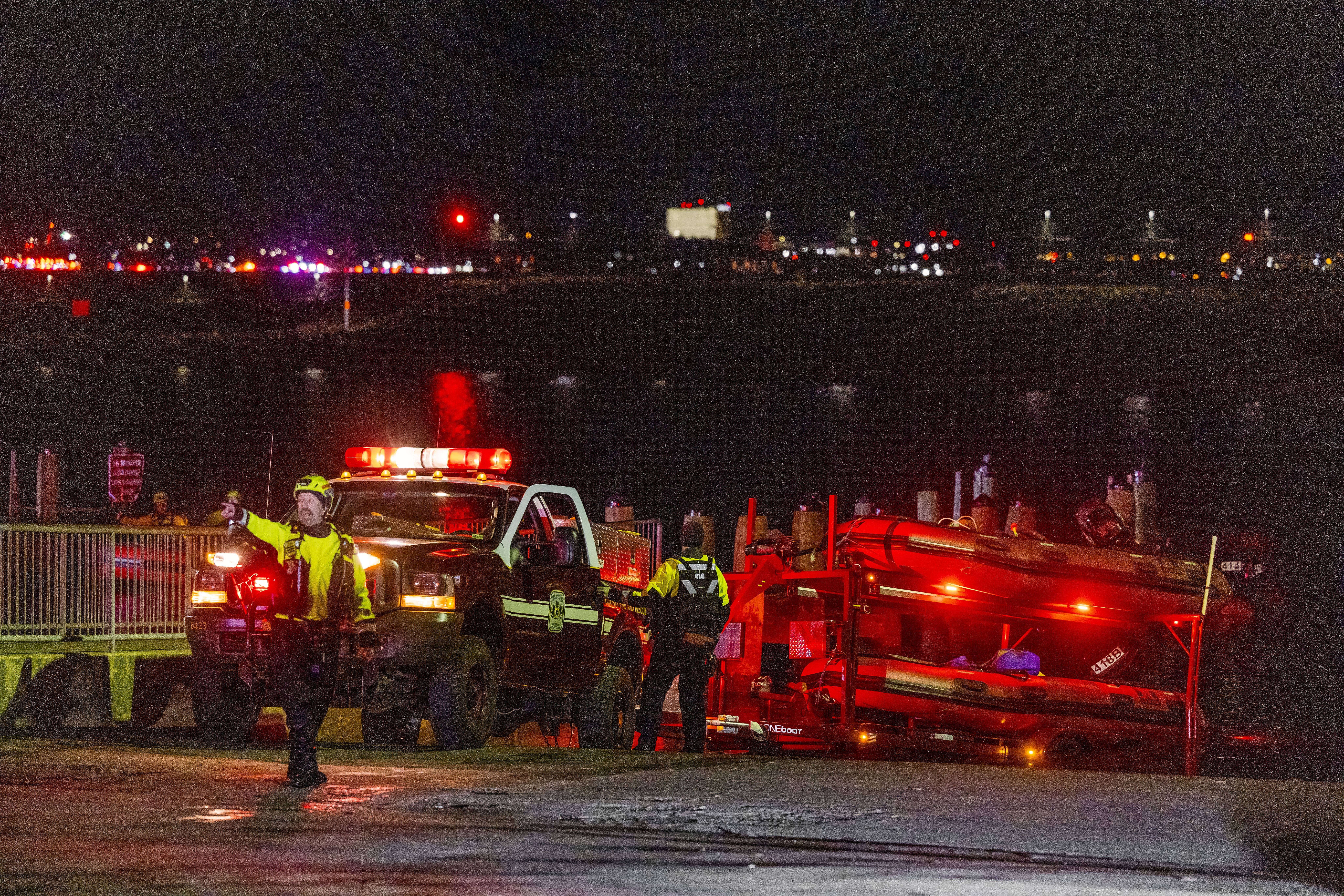 Rescue teams search the Potomac River