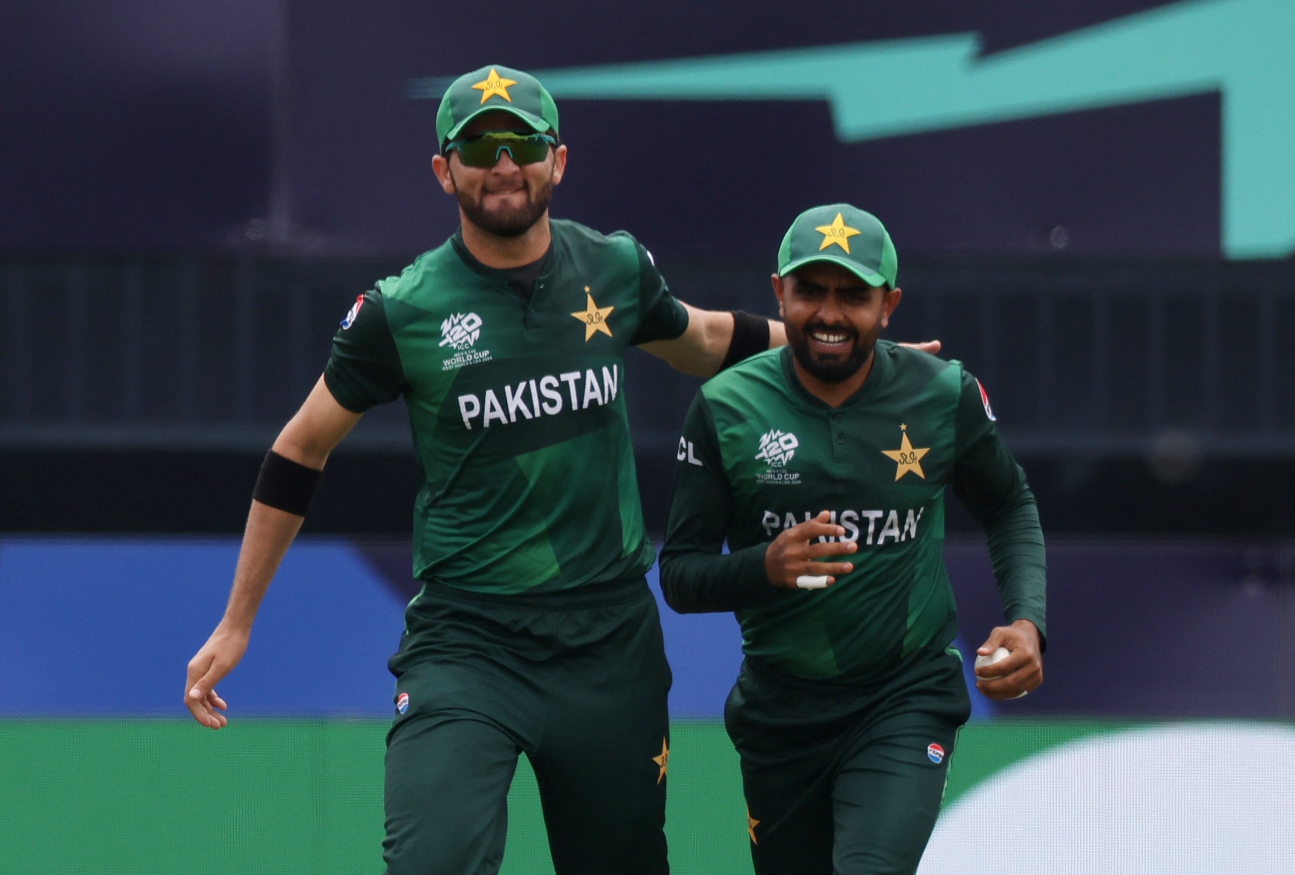 Cricket - ICC T20 World Cup 2024 - Group A - India v Pakistan - Nassau County International Cricket Stadium, New York, United States - June 9, 2024 Pakistan's Babar Azam celebrates with Shaheen Shah Afridi after taking the wicket of India's Rishabh Pant REUTERS/Andrew Kelly