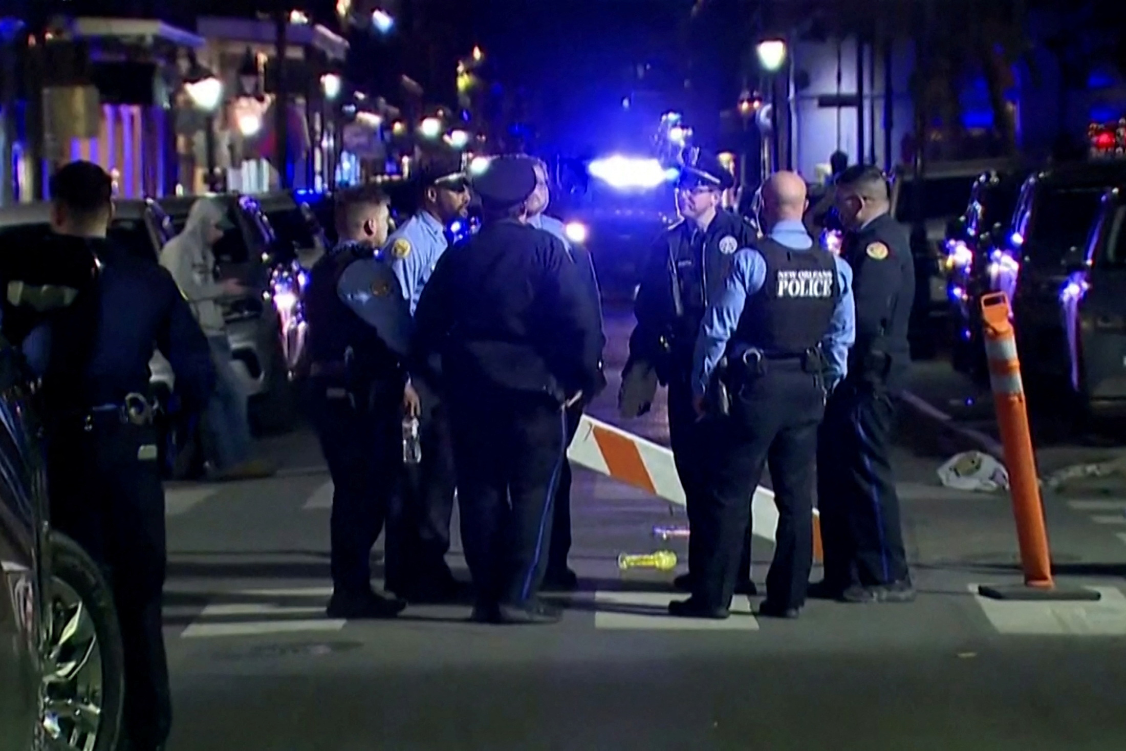 Police attend the scene after a vehicle drove into a crowd on New Orleans' Canal and Bourbon Street