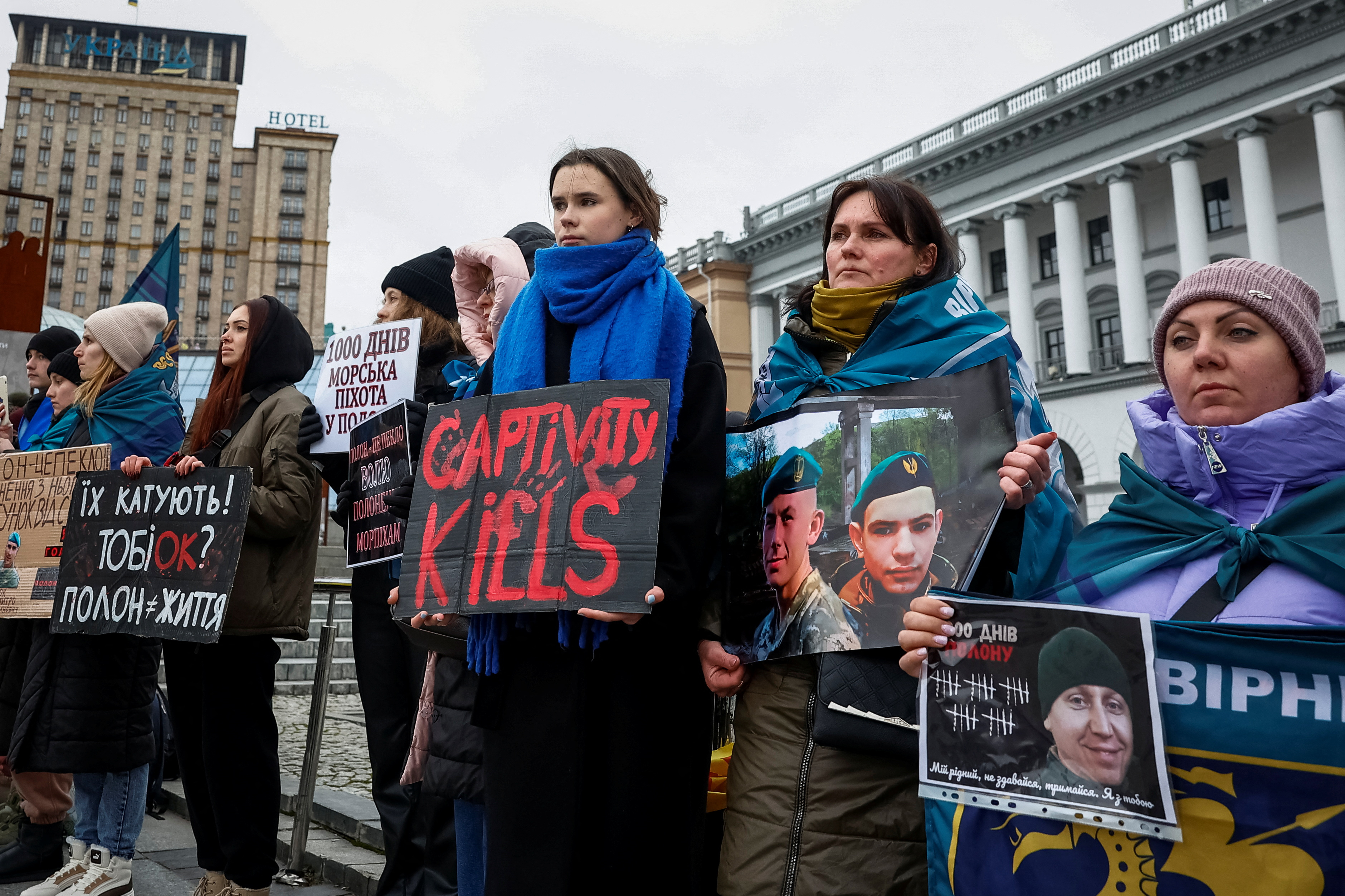 Arina, 15-years-old, and her mother Alina, 47-years-old, hold banners as they attend a rally calling for the return of her cousins Kyrylo, 25-years-old, and Anton, 21-years-old, and other Ukrainian Marines who defended the Azovstal and are currently prisoners of war, from Russian captivity, amid Russia's attack on Ukraine, in Kyiv, Ukraine January 6, 2025. REUTERS/Alina Smutko