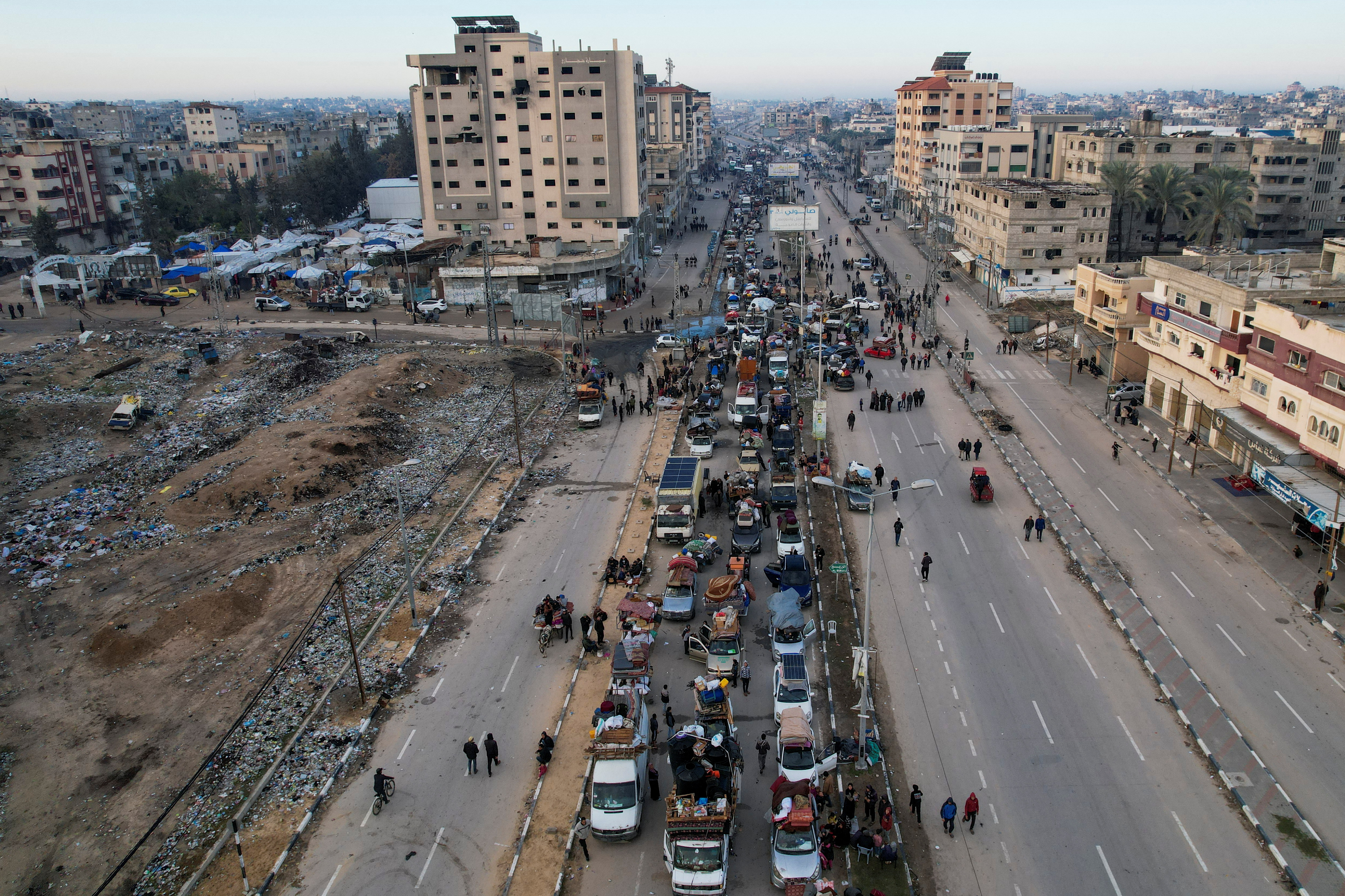 Palestinians wait to be allowed to return to their homes in northern Gaza after they were displaced, in the central Gaza Strip, January 26, 2025 [Reuters]