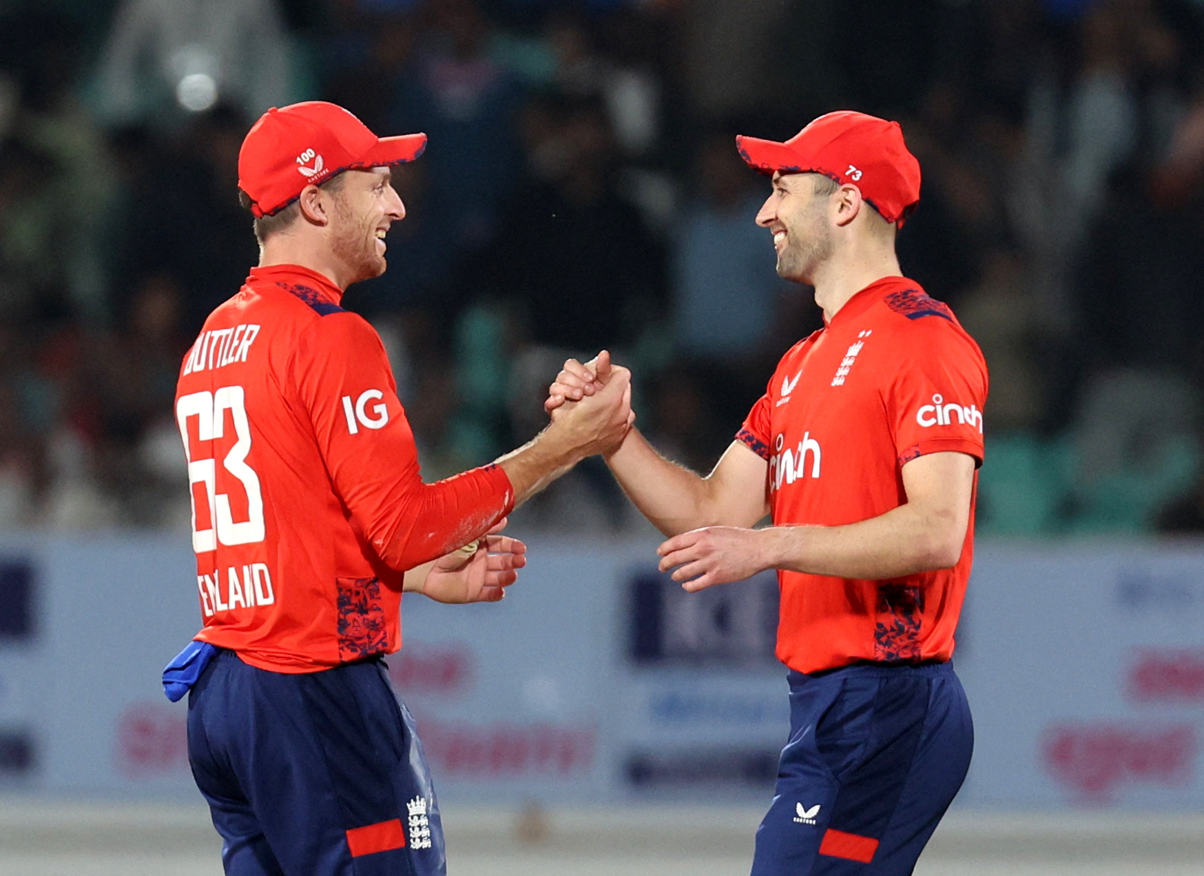 Cricket - Third T20 International - India v England - Saurashtra Cricket Association Stadium, Rajkot, India - January 28, 2025 England's Jos Buttler shakes hands with Mark Wood after the match REUTERS/Amit Dave