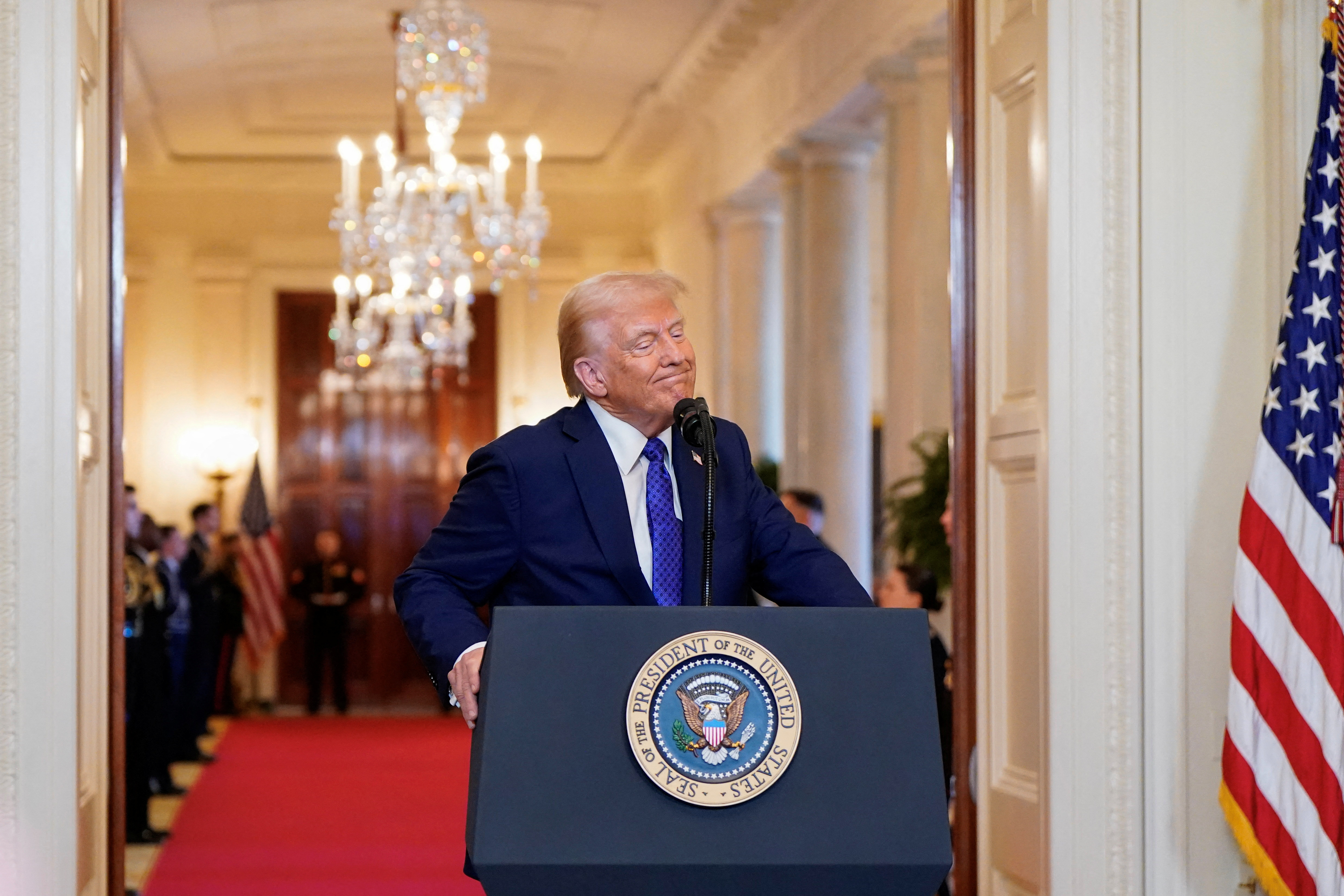 Donald Trump at a podium at the White House