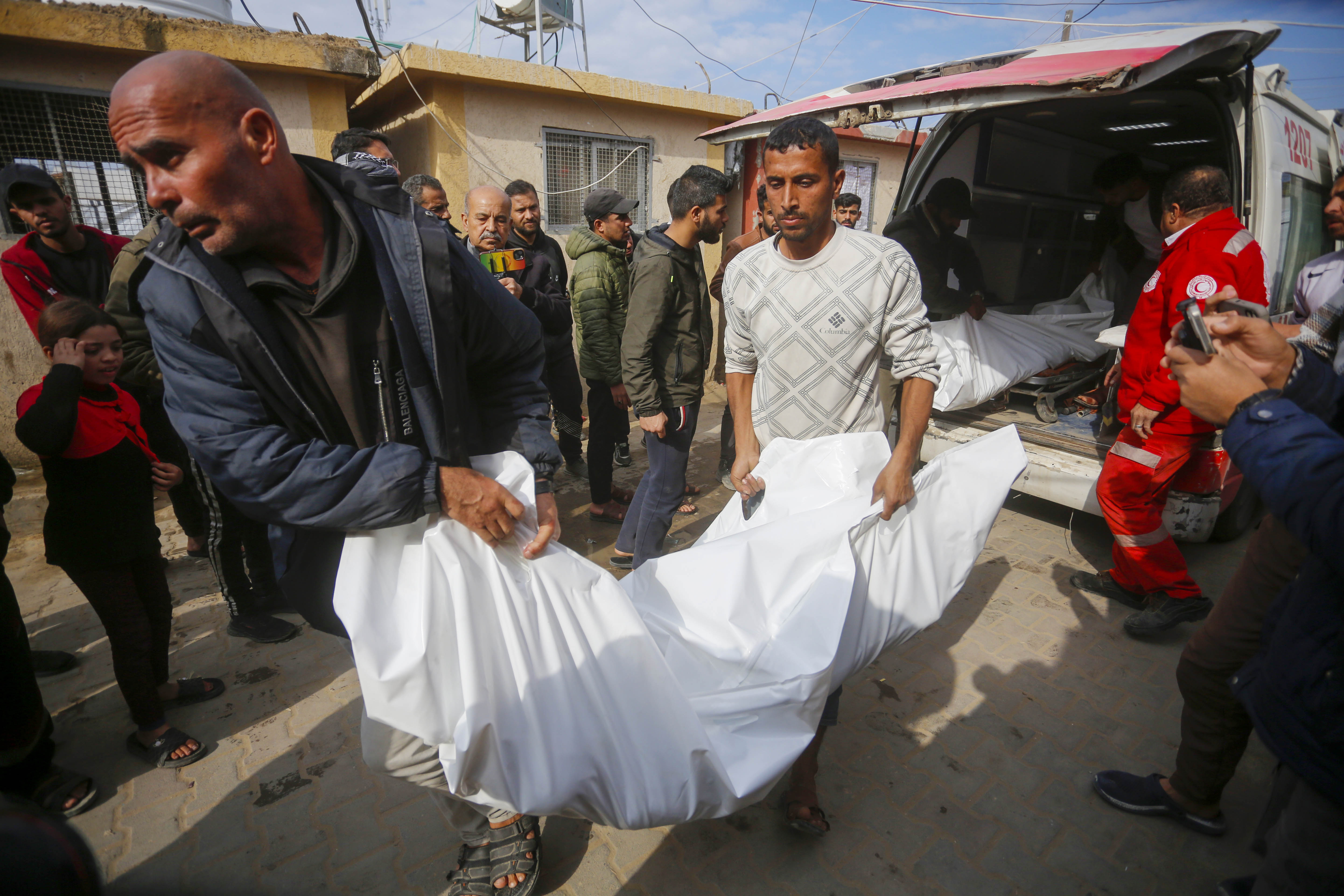 Injured Palestinians, including children, are brought to Al-Aqsa Martyrs Hospital.