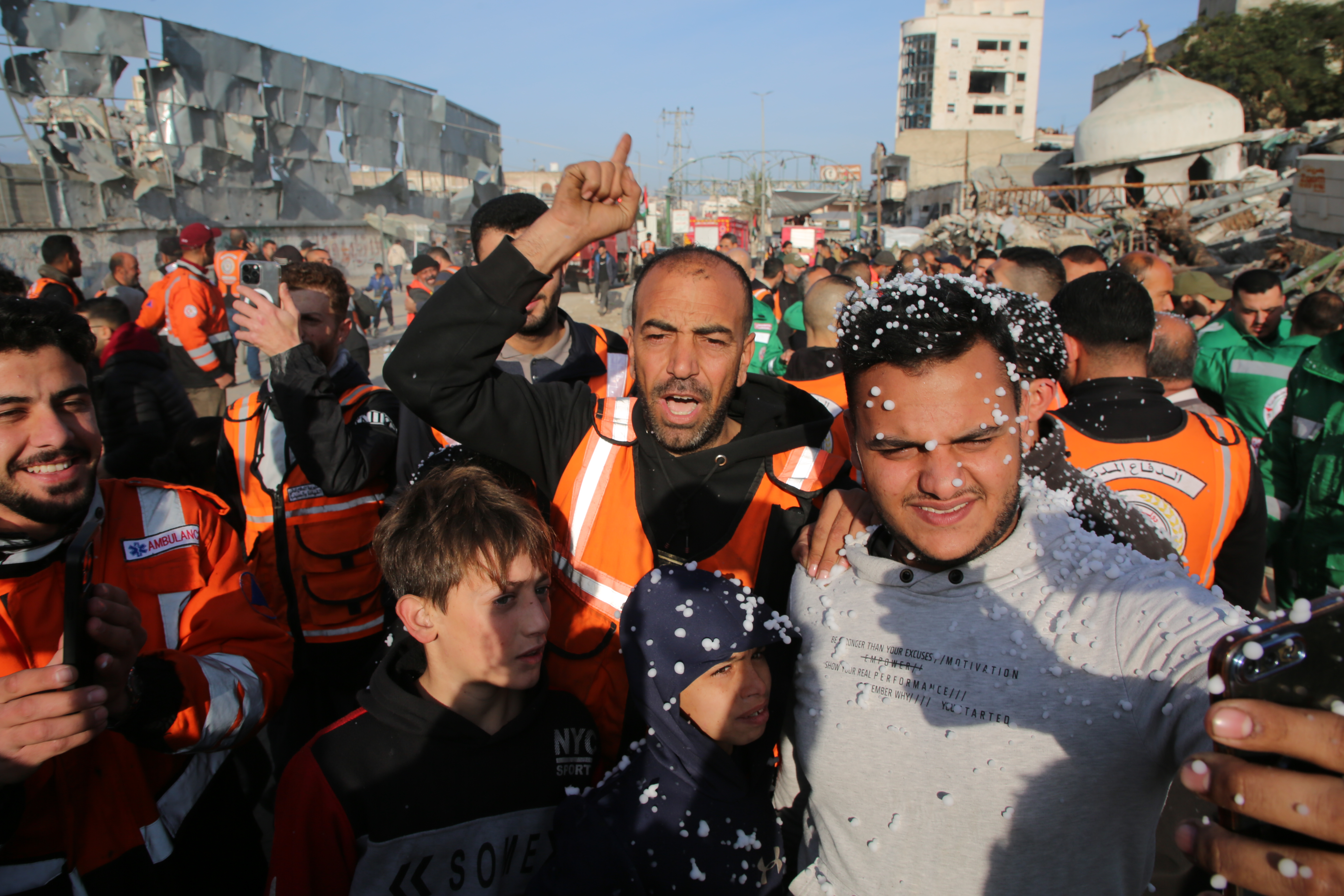Palestinians celebrate the ceasefire announcement
