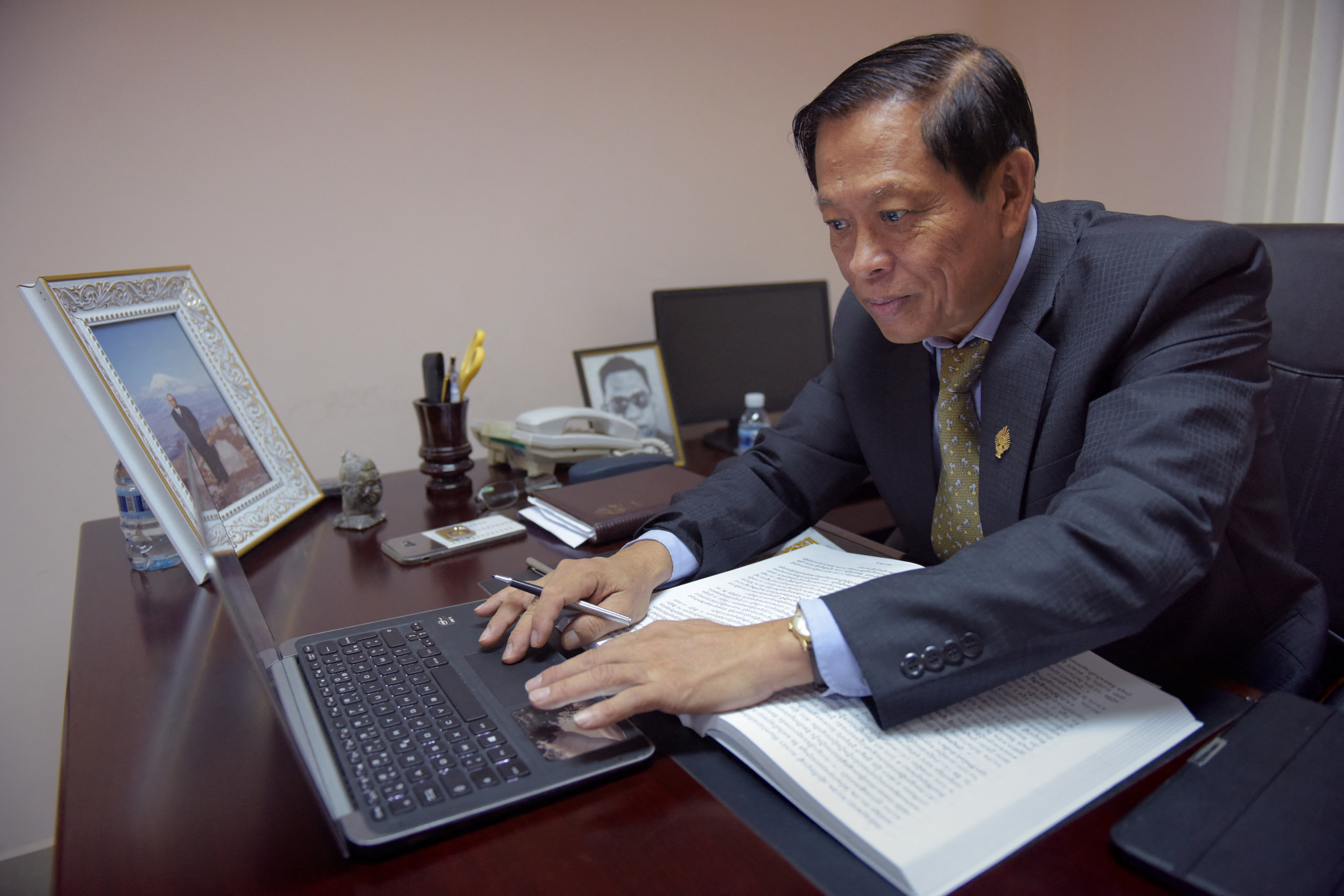 In this October 26, 2017 photograph, Lim Kimya, a member of the National Assembly from Cambodia National Rescue Party, works in his office in Phnom Penh.