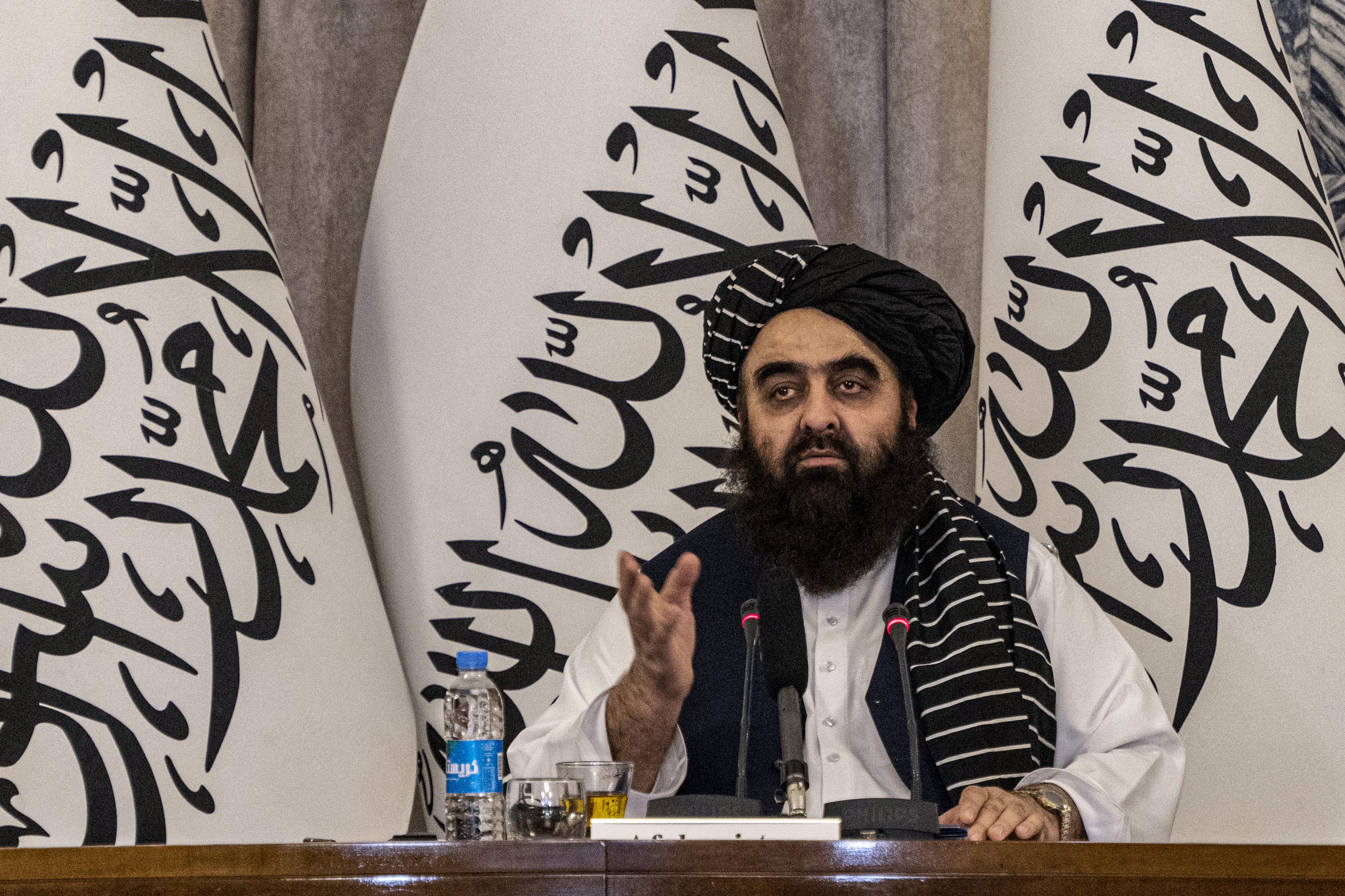 Afghanistan's acting minister of foreign affairs, Amir Khan Muttaqi, speaks during a conference.