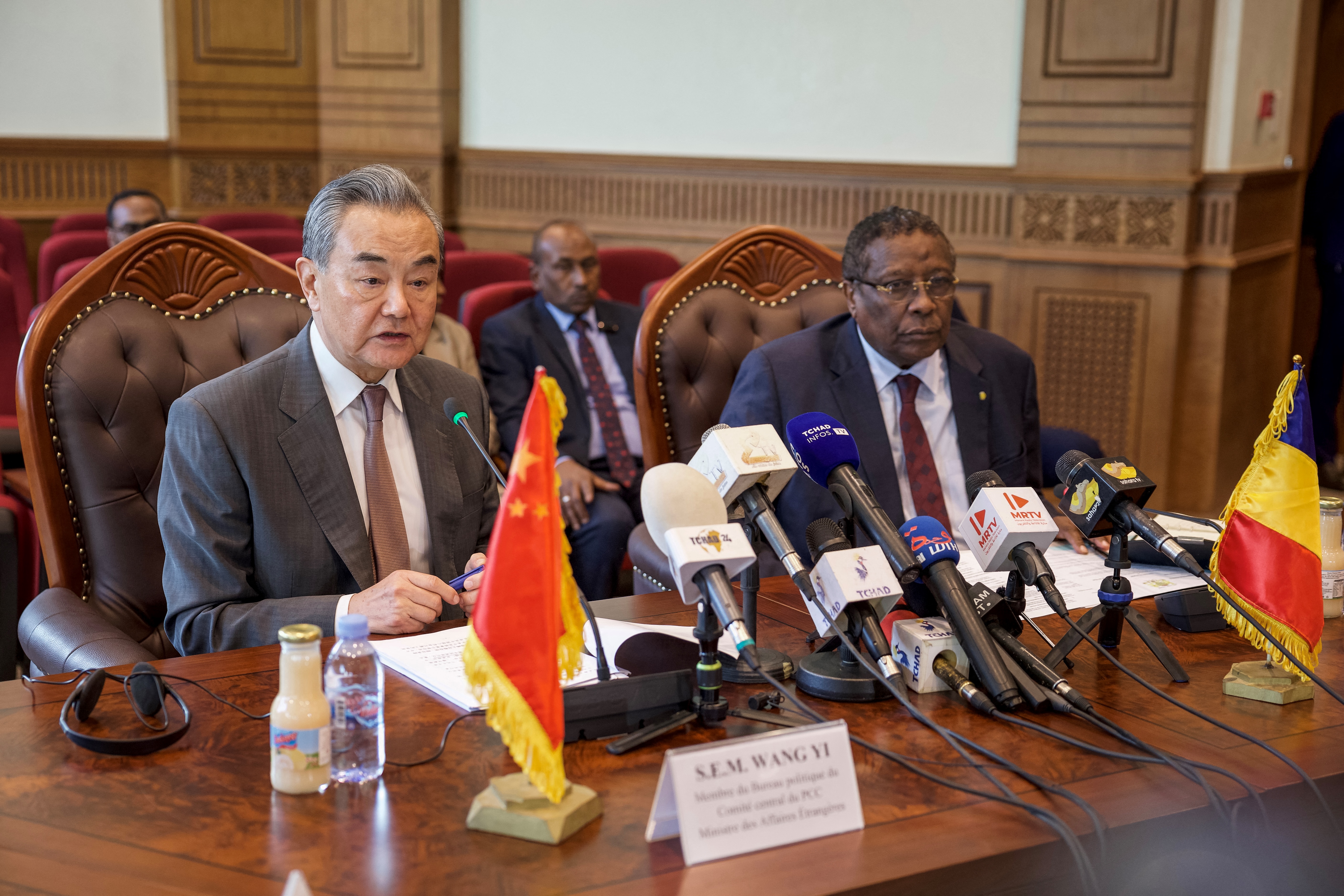 Chad's Foreign Minister Abderaman Koulamallah (R) meets with Minister of Foreign Affairs of China Wang Yi (L) at the Ministry of Foreign affairs in N'Djamena on January 8, 2025. (Photo by Joris Bolomey / AFP)