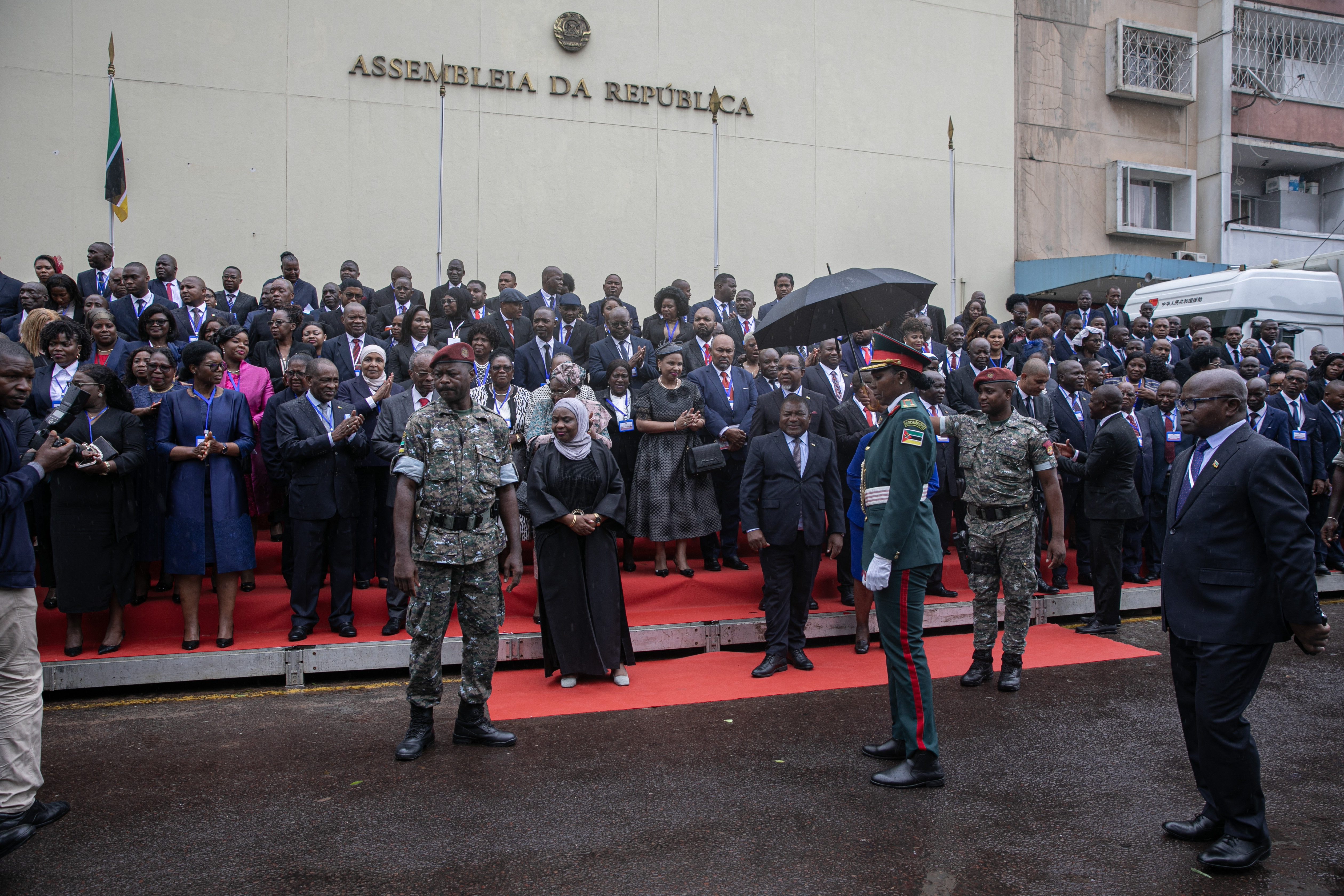 Members of Parliament from different parties of the Assembly prepare to take the official photograph following the swearing in ceremony of the new Parliament at the National Assembly in Maputo