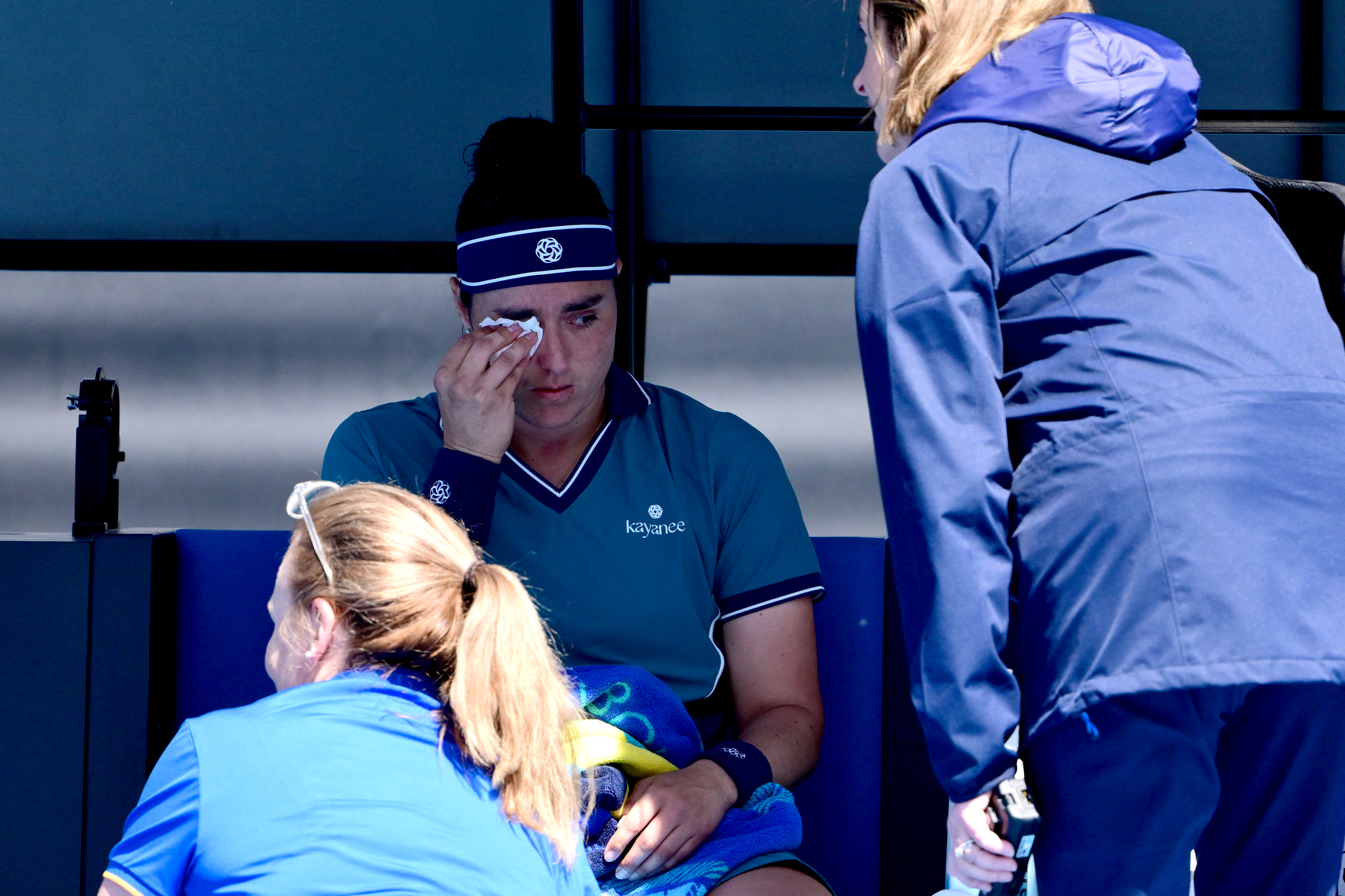 Tunisias Ons Jabeur gets medical attention as she plays against Colombia's Camila Osorio during their women's singles match on day five of the Australian Open tennis tournament in Melbourne on January 16, 2025. (Photo by Yuichi YAMAZAKI / AFP) / -- IMAGE RESTRICTED TO EDITORIAL USE - STRICTLY NO COMMERCIAL USE --