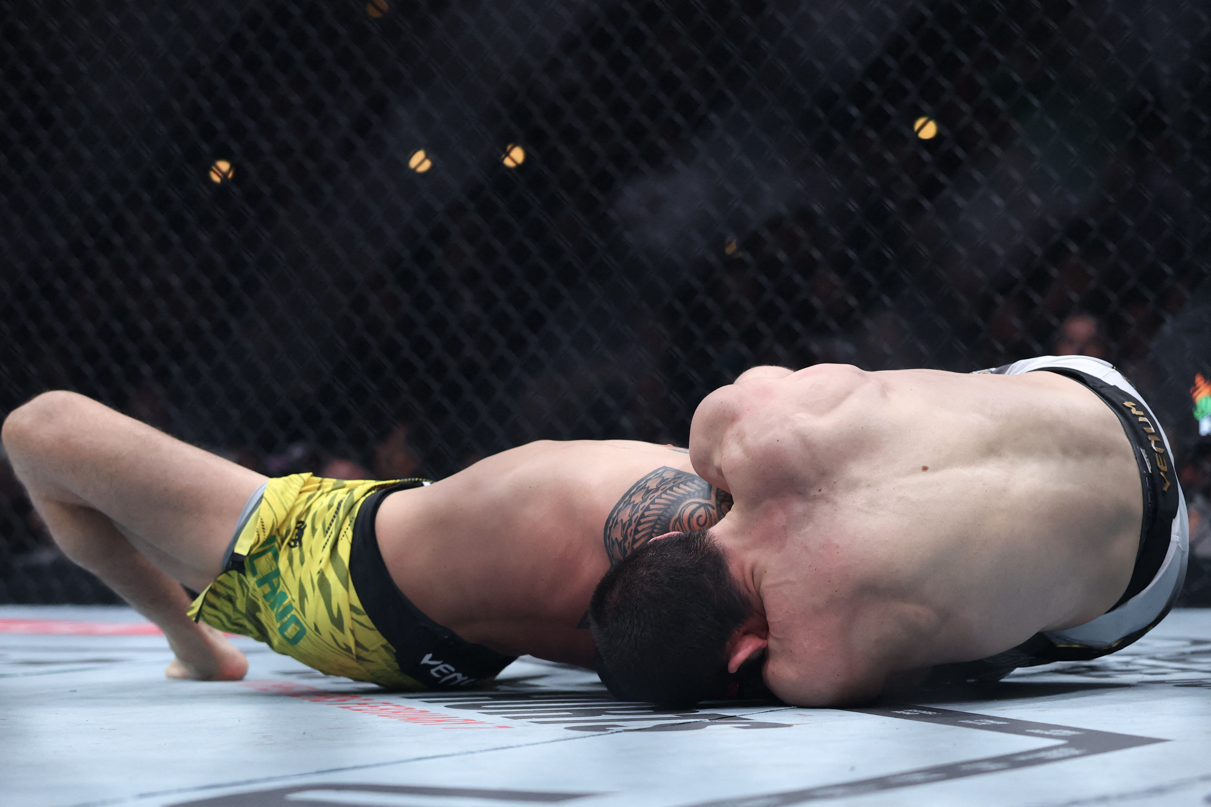 INGLEWOOD, CALIFORNIA - JANUARY 18: Islam Makhachev of Russia submits Renato Moicano of Brazil in a lightweight title fight during UFC 311 at Intuit Dome on January 18, 2025 in Inglewood, California. Harry How/Getty Images/AFP (Photo by Harry How / GETTY IMAGES NORTH AMERICA / Getty Images via AFP)