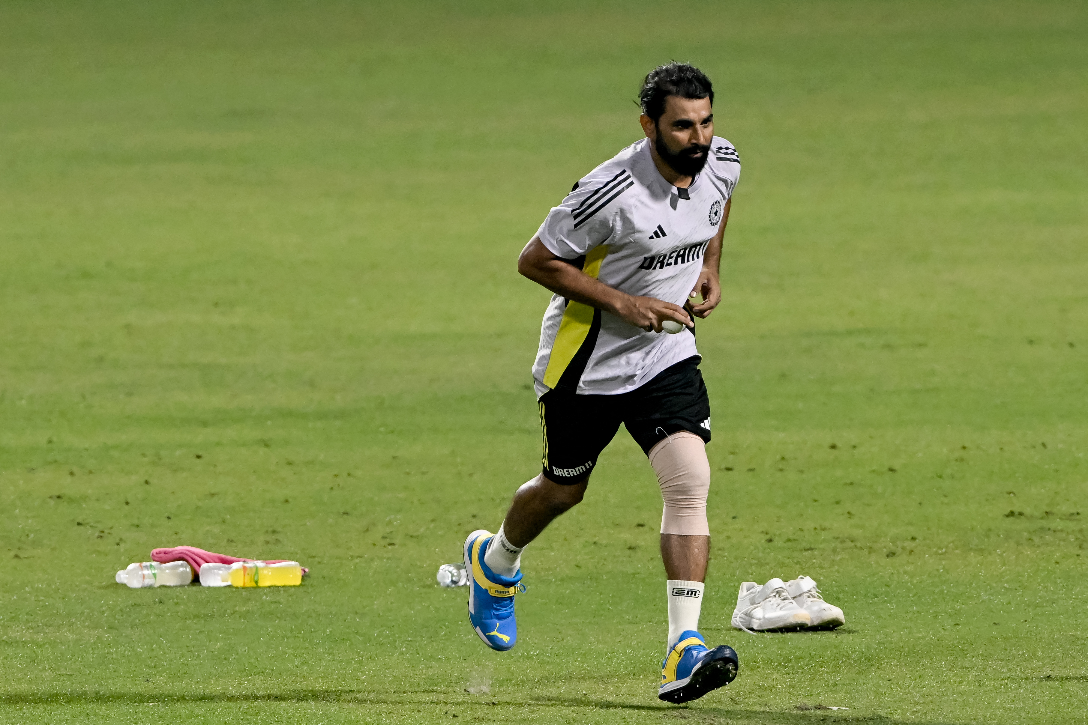 India's Mohammed Shami bowls in the nets during a practice session ahead of their first Twenty20 international cricket match against England at the Eden Gardens in Kolkata on January 19, 2025. (Photo by Dibyangshu SARKAR / AFP)
