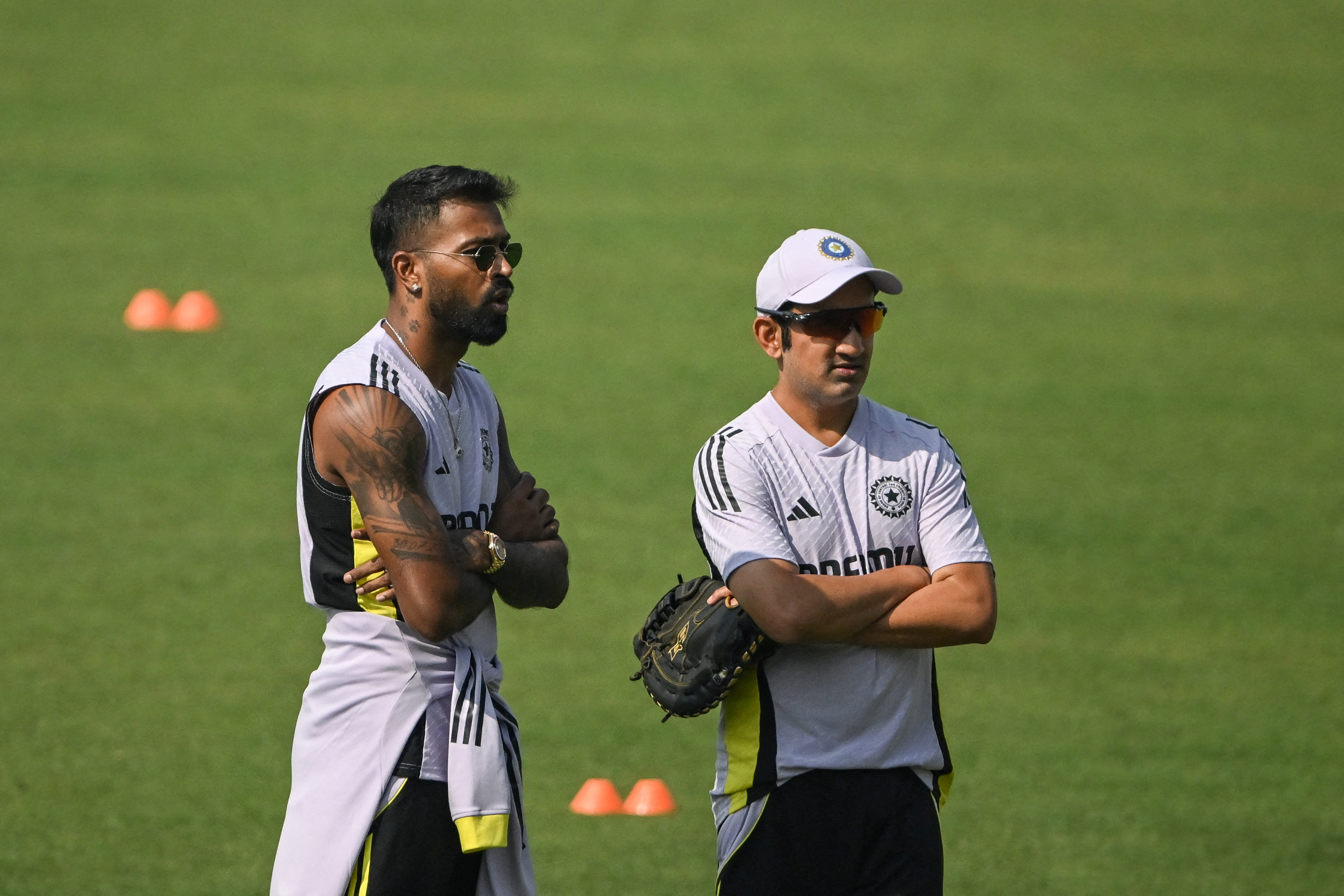 Indias Hardik Pandya (L) talks with coach Gautam Gambhir as he attends a practice session ahead of their first Twenty20 international cricket match against England at the Eden Gardens in Kolkata on January 20, 2025. (Photo by DIBYANGSHU SARKAR / AFP) / -- IMAGE RESTRICTED TO EDITORIAL USE - STRICTLY NO COMMERCIAL USE --