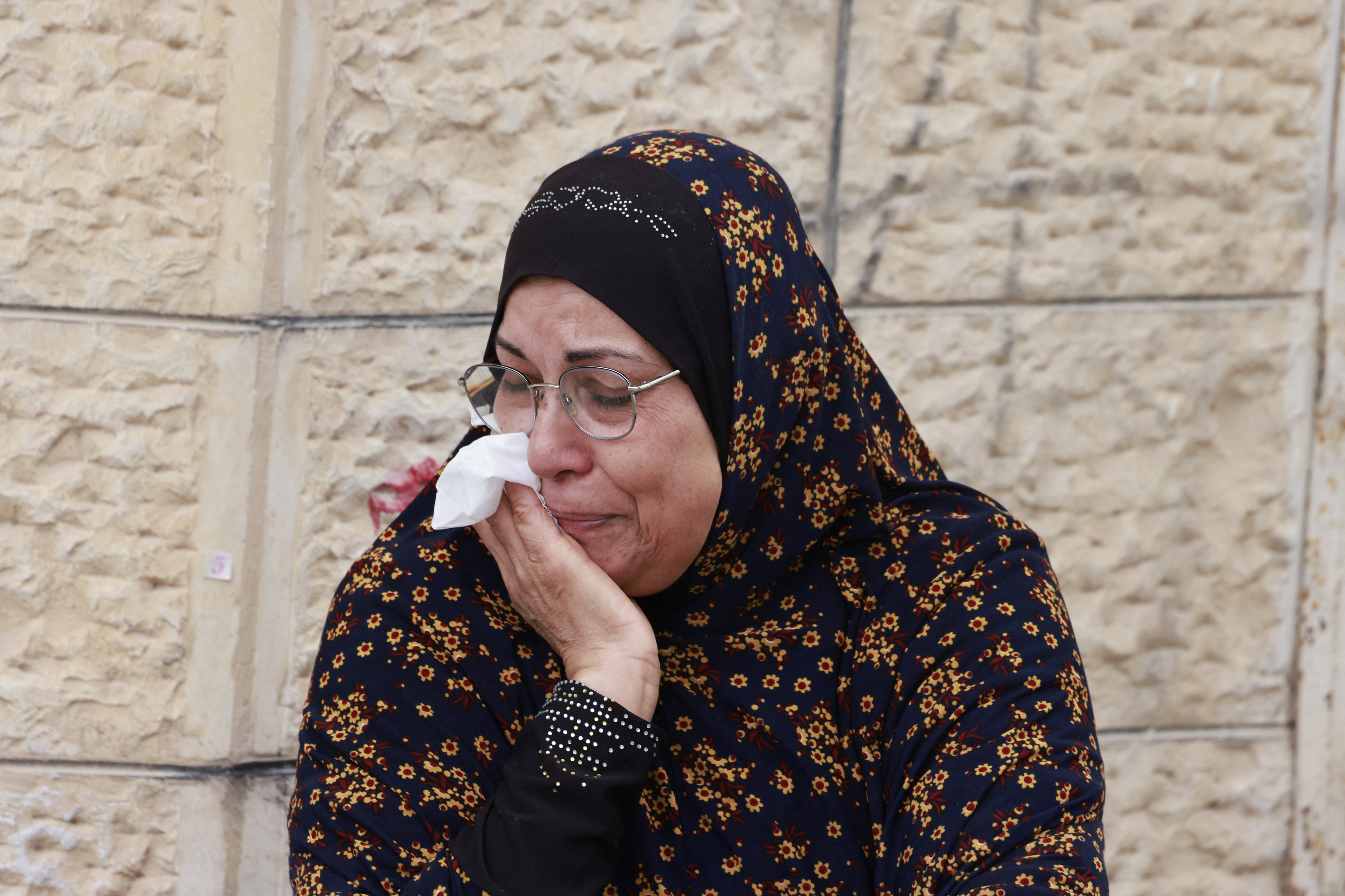 A Palestinian woman reacts during a large-scale Israeli army raid in Jenin, in the occupied West Bank, on January 24, 2025 [Jaafar Ashtiyeh/ AFP)