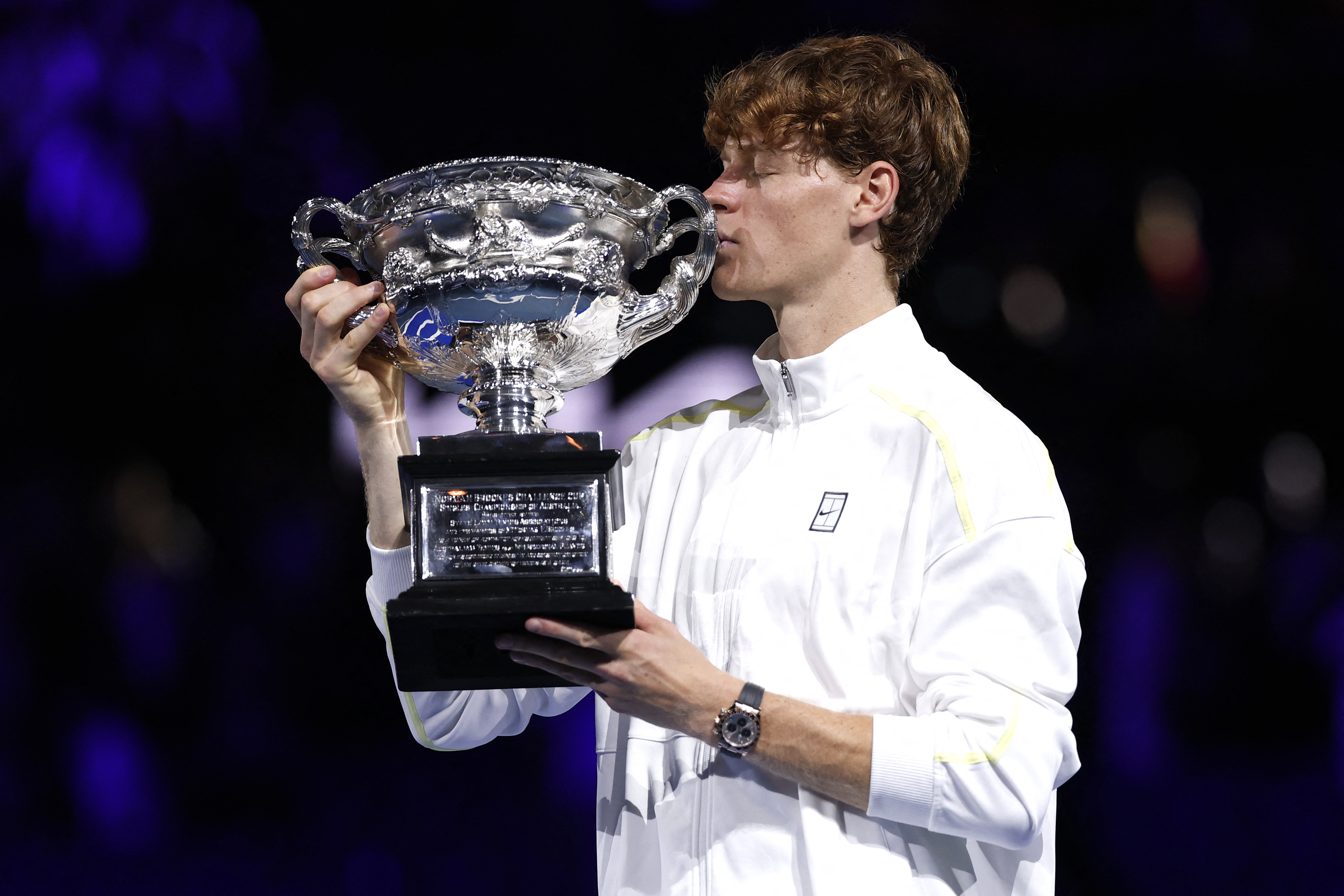 Italy's Jannik Sinner celebrates with the Norman Brookes Challenge Cup trophy after defeating Germany's Alexander Zverev during their men's singles final match on day fifteen of the Australian Open tennis tournament in Melbourne on January 26, 2025. (Photo by Martin KEEP / AFP) / -- IMAGE RESTRICTED TO EDITORIAL USE - STRICTLY NO COMMERCIAL USE --
