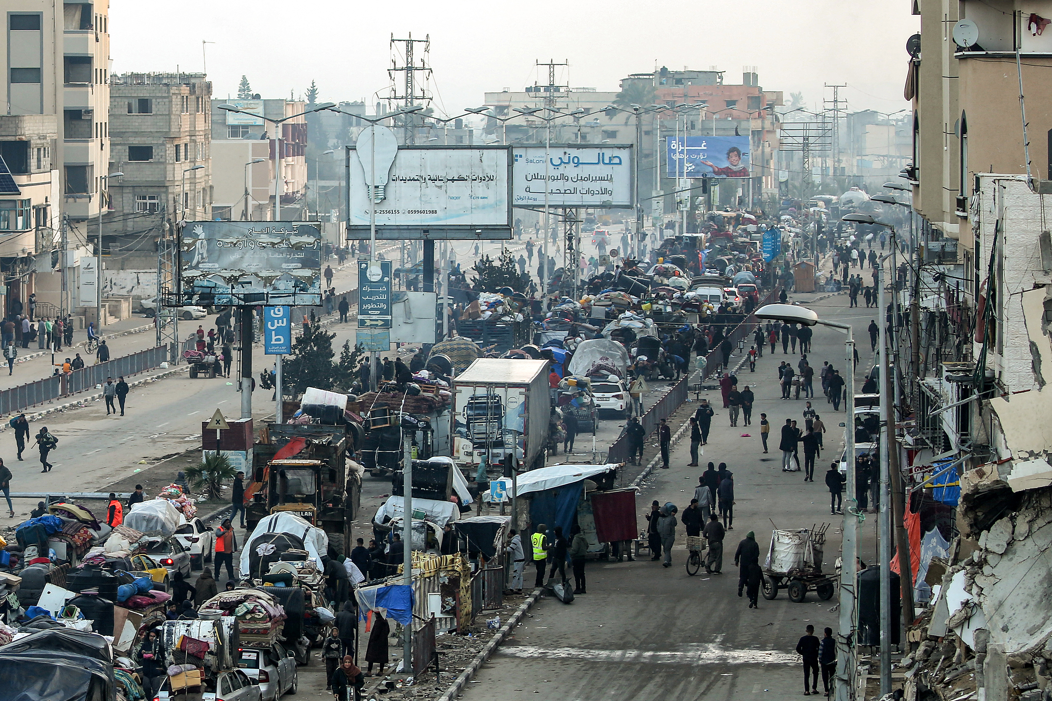 Vehicles queue up along the Salah al-Din Street in Nuseirat, Gaza