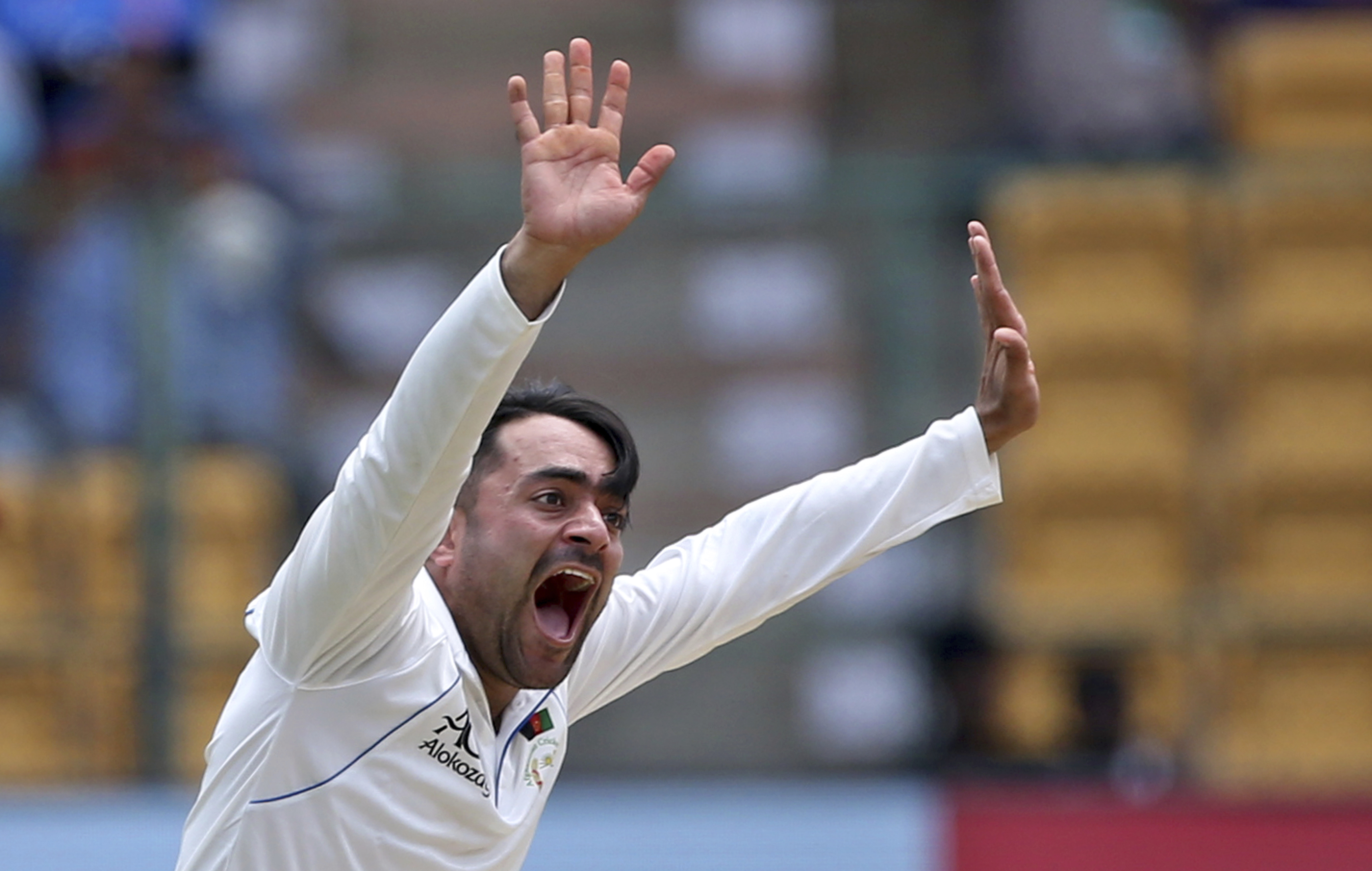 Afghanistan's Rashid Khan appeals successfully for the wicket of India's Ishant Sharma.