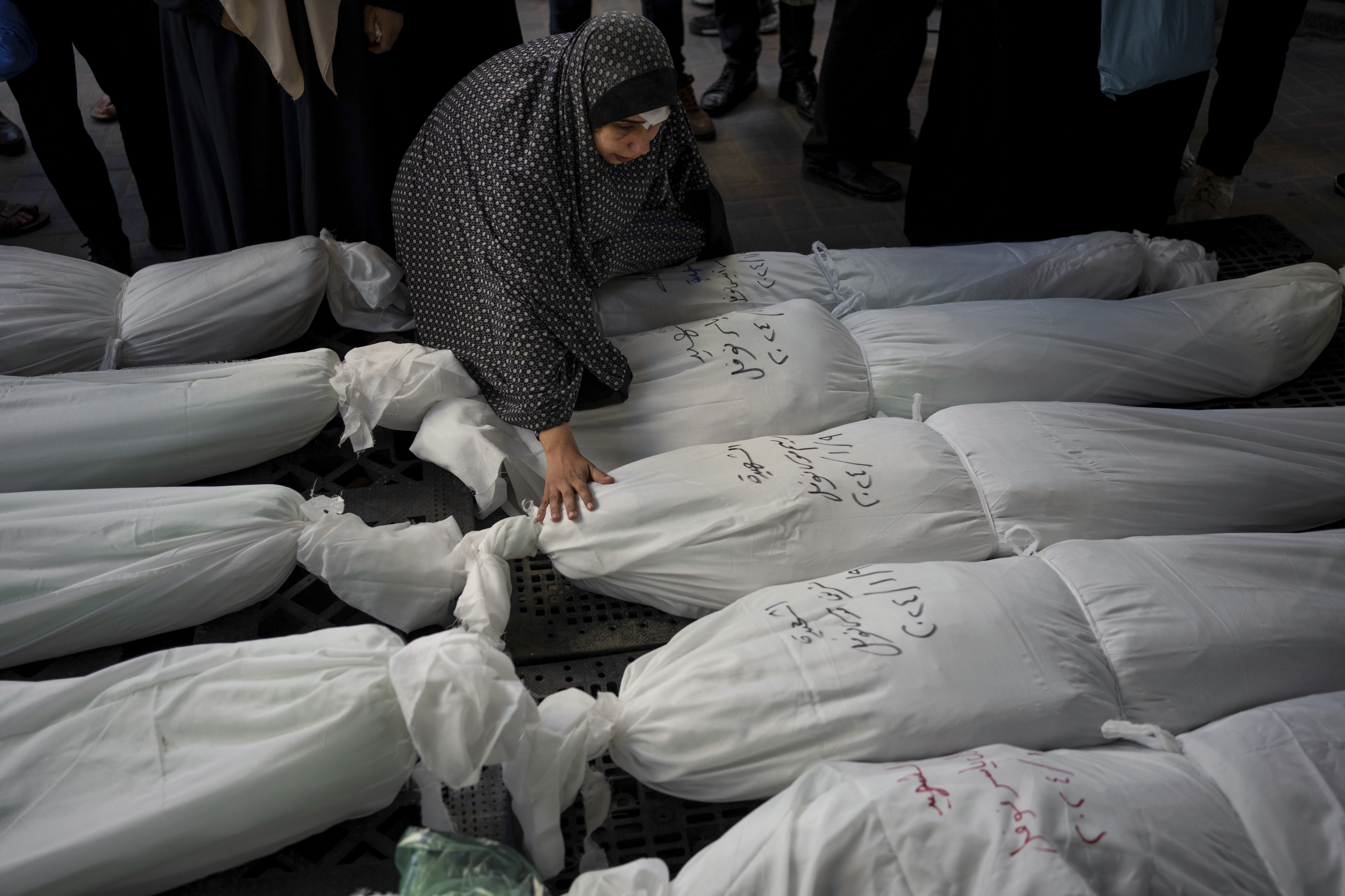 Palestinians mourn their relatives killed in the Israeli bombardment of the Gaza Strip