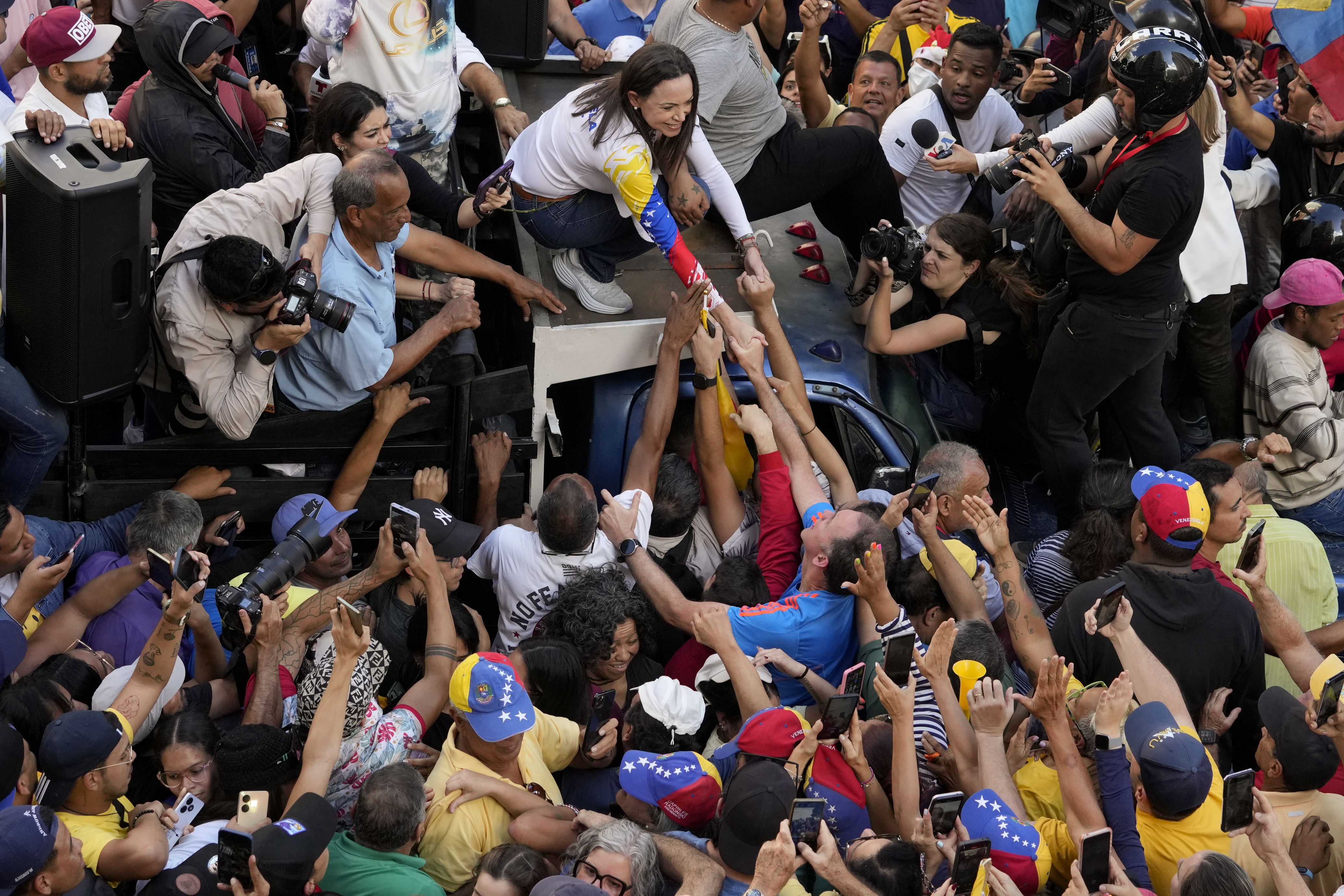 Maria Corina Machado greets a crowd of supporters on January 9