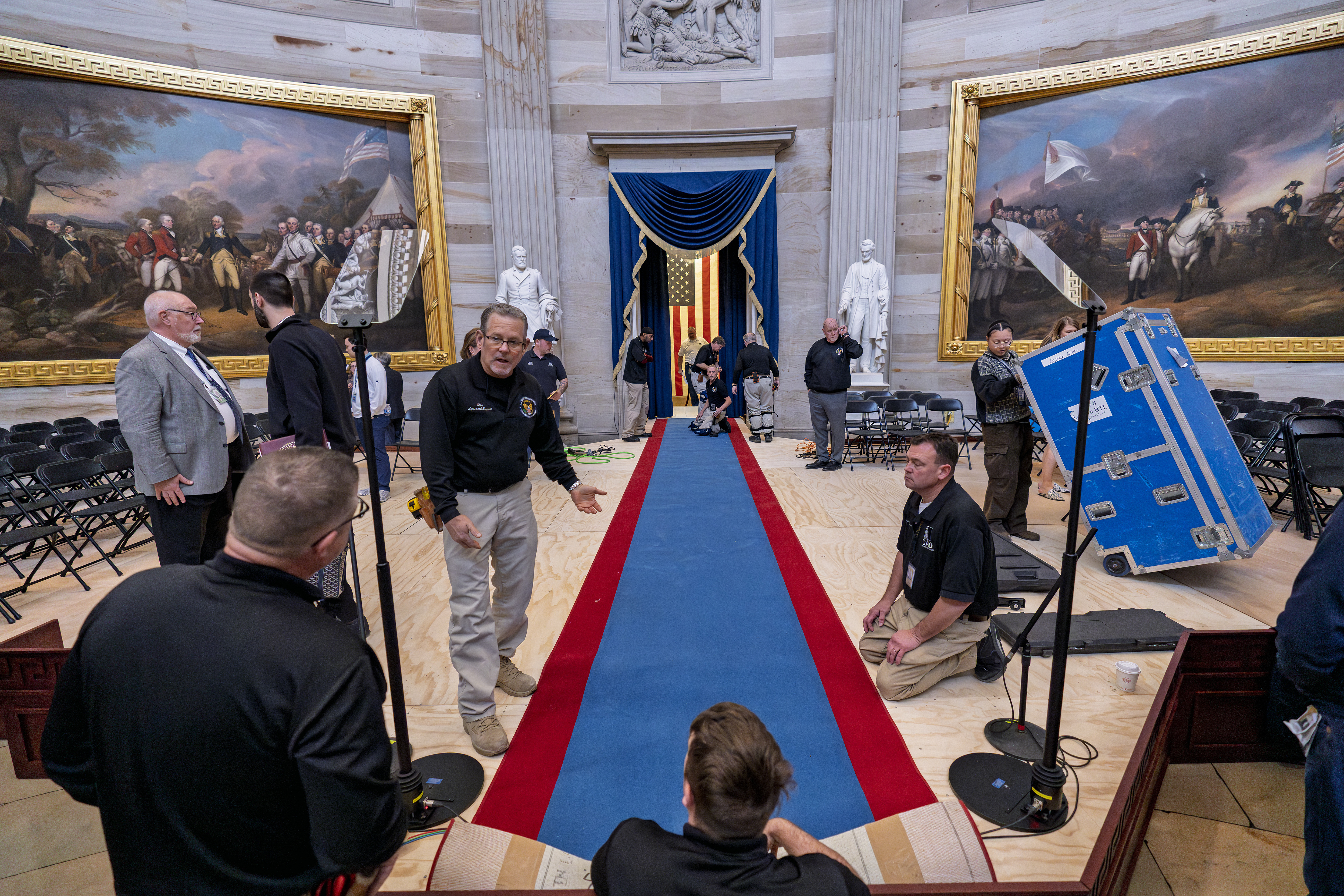 Organizers work to move the Inauguration Day swearing-in ceremony into the Capitol Rotunda due to expected frigid weather in Washington, Saturday, Jan. 18, 2025. (AP Photo/J. Scott Applewhite)