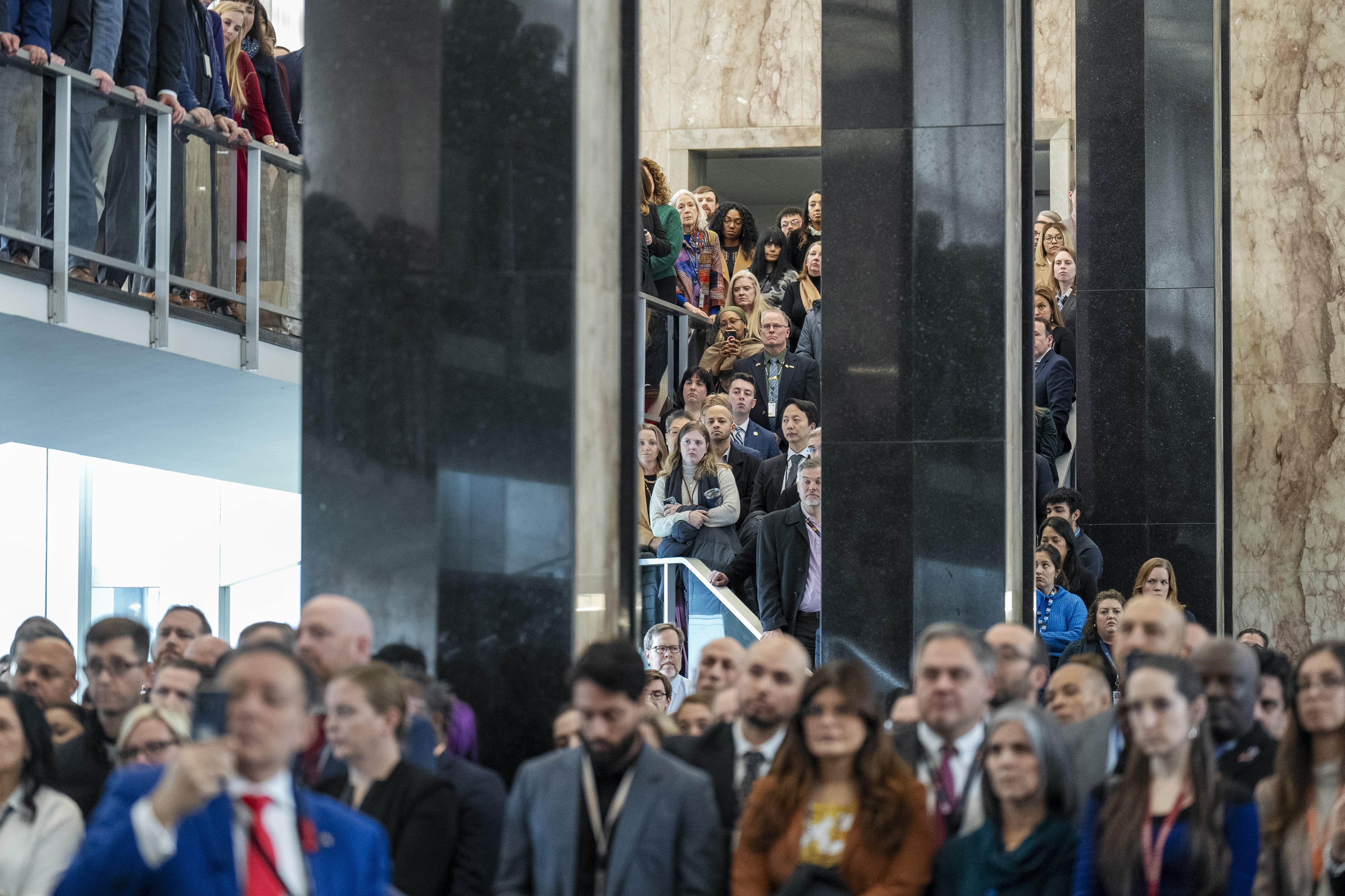 State Department employees gather to watch Marco Rubio at the Eisenhower building.