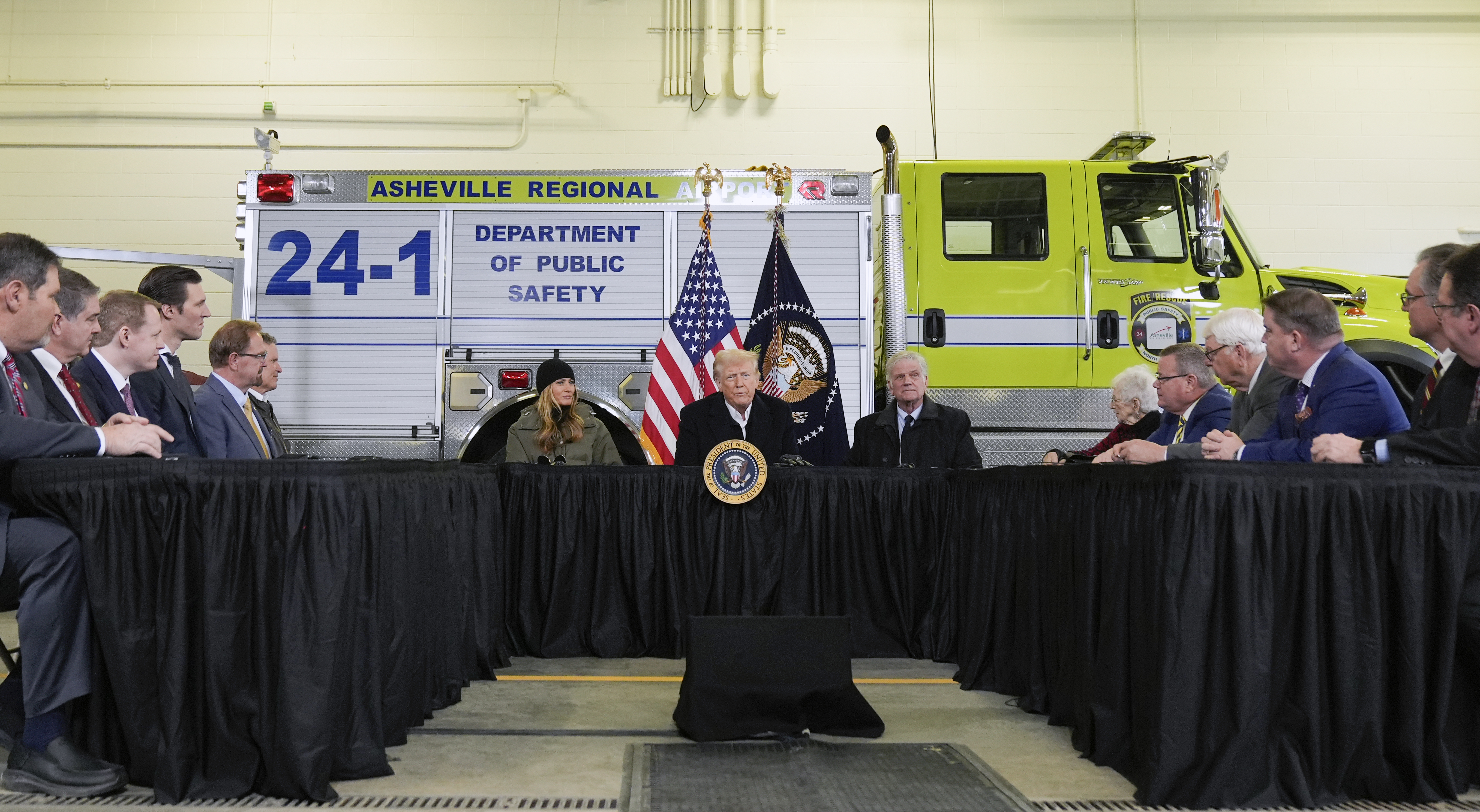 President Donald Trump speaks at a U-shaped table at a press conference in North Carolina