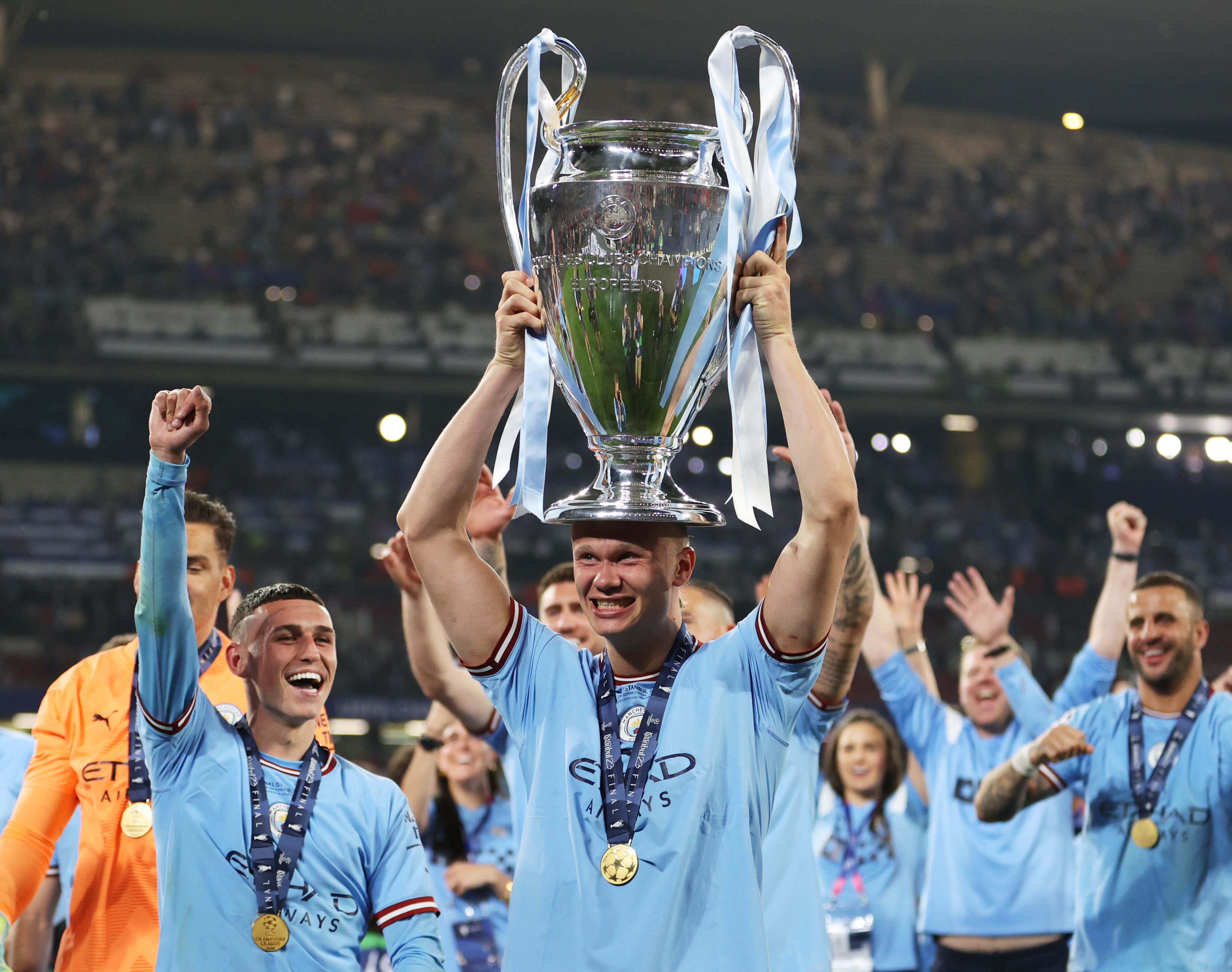 ISTANBUL, TURKEY - JUNE 10: Erling Haaland of Manchester City celebrates with the UEFA Champions League trophy after the team's victory during the UEFA Champions League 2022/23 final match between FC Internazionale and Manchester City FC at Ataturk Olympic Stadium on June 10, 2023 in Istanbul, Turkey. (Photo by Michael Steele/Getty Images)
