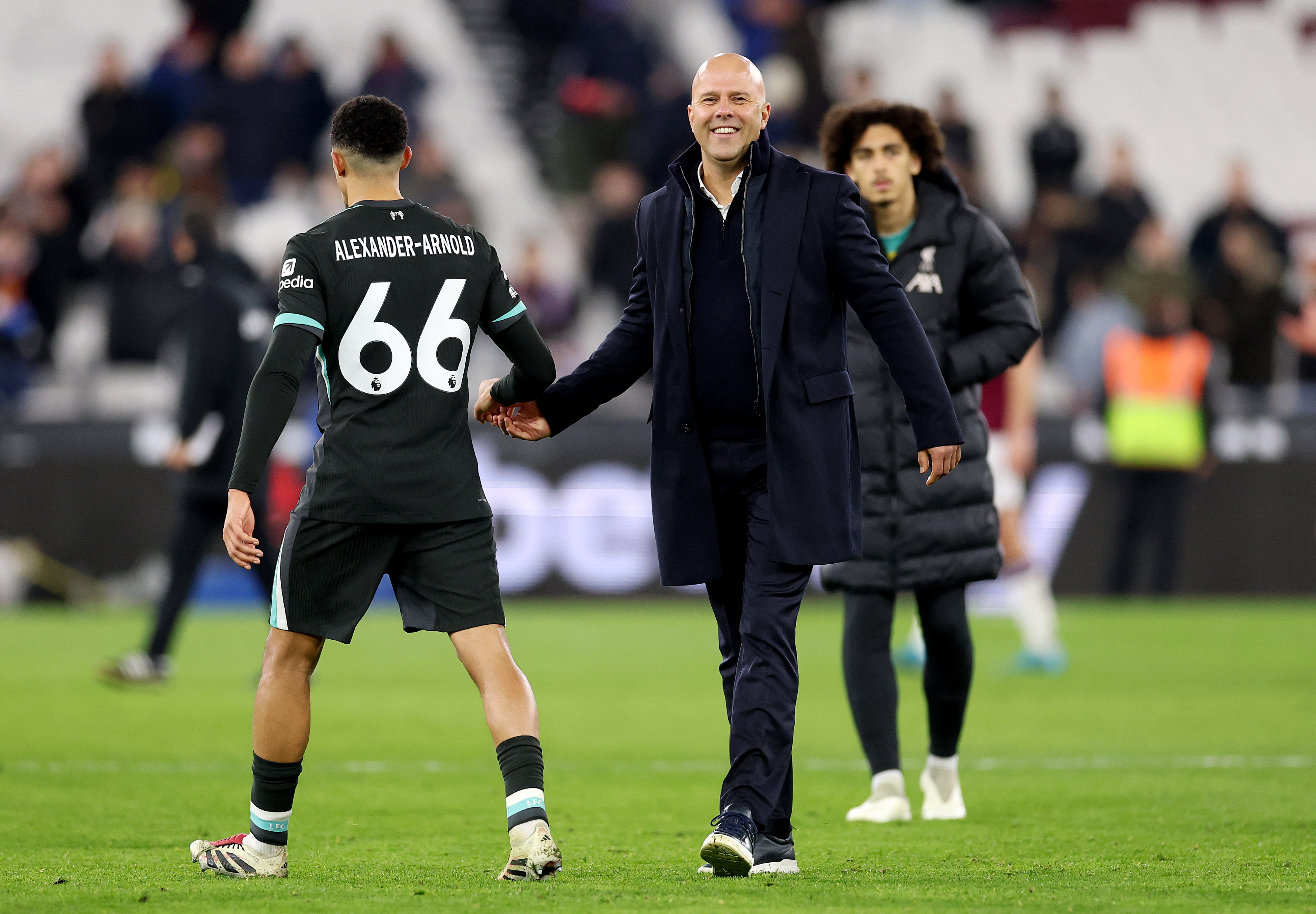 LONDON, ENGLAND - DECEMBER 29: Arne Slot, Manager of Liverpool, interacts with Trent Alexander-Arnold of Liverpool after the Premier League match between West Ham United FC and Liverpool FC at London Stadium on December 29, 2024 in London, England. (Photo by Julian Finney/Getty Images)