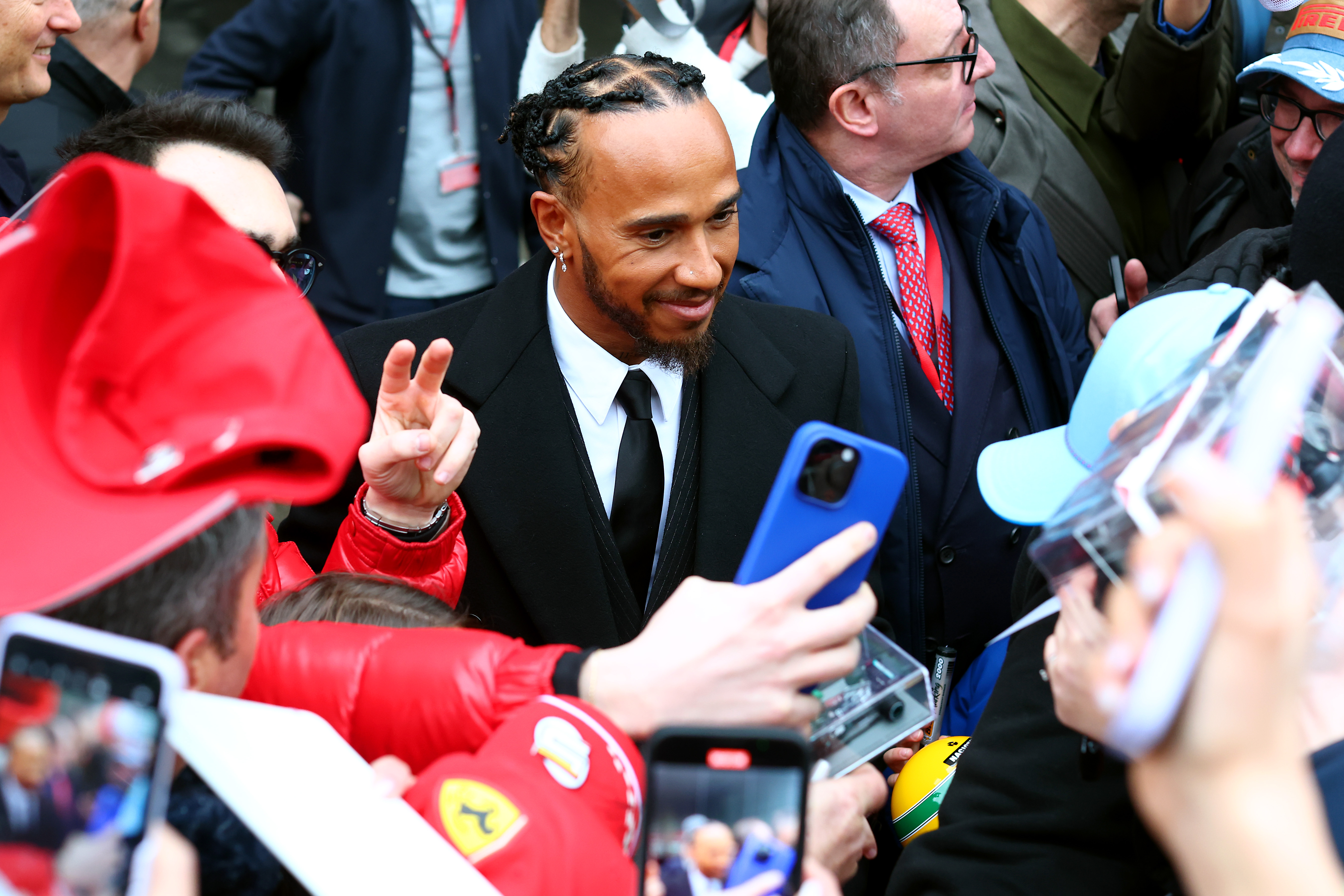 Lewis hamilton greets crowd.