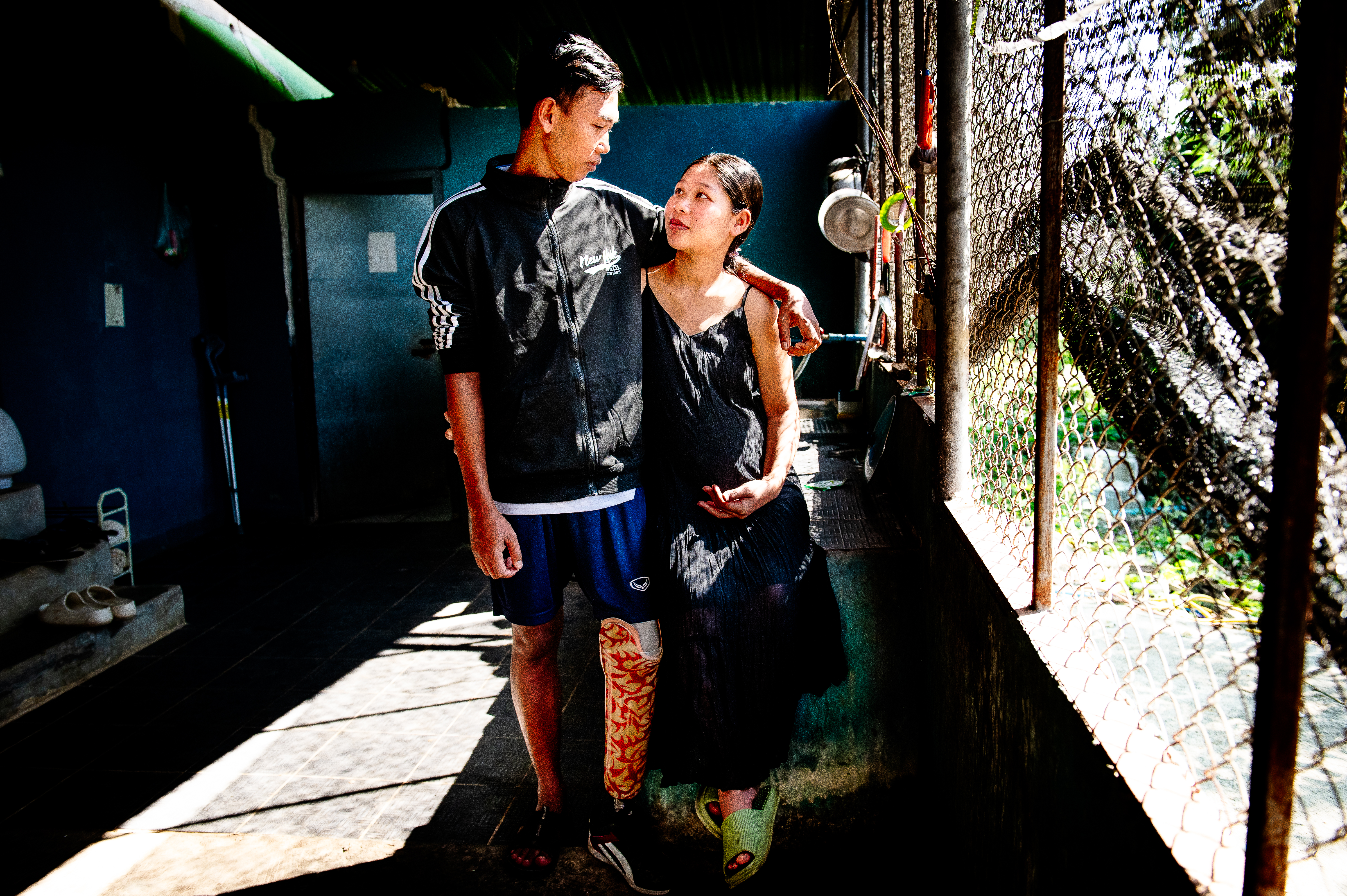 Peoples Defence Force soldier Mae Gyi and his pregnant wife San. Mae Gyi told Al Jazeera that despite his amputated leg, he wants to return to the battlefield and continue fighting Myanmar’s military [Ali MC/Al Jazeera]