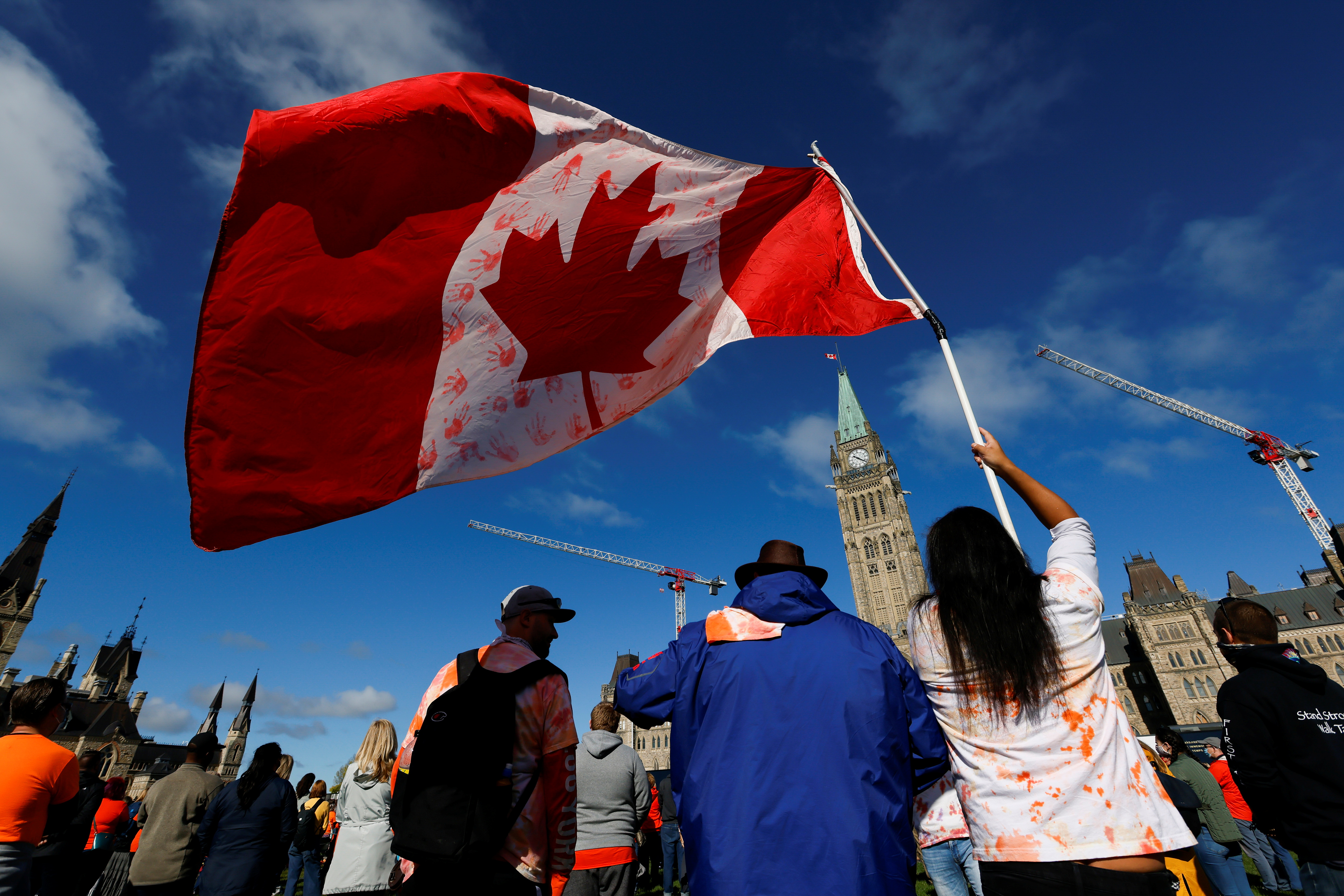 People gather on Parliament Hill in Ottawa, Canada