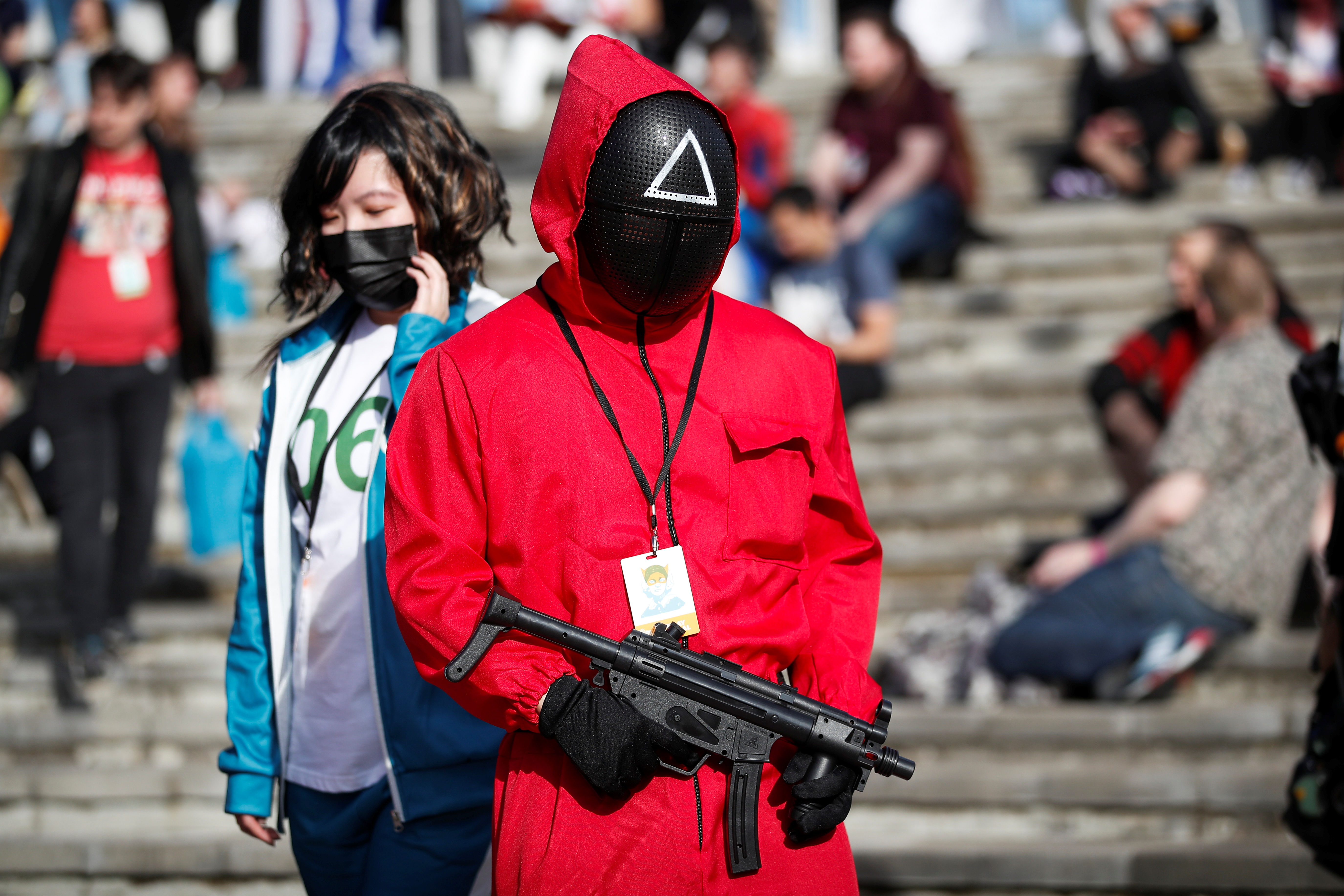 A person wearing a "Squid Game" costume attends the MCM Comic Con event outside ExCeL in London, Britain, October 24, 2021. REUTERS/Peter Nicholls
