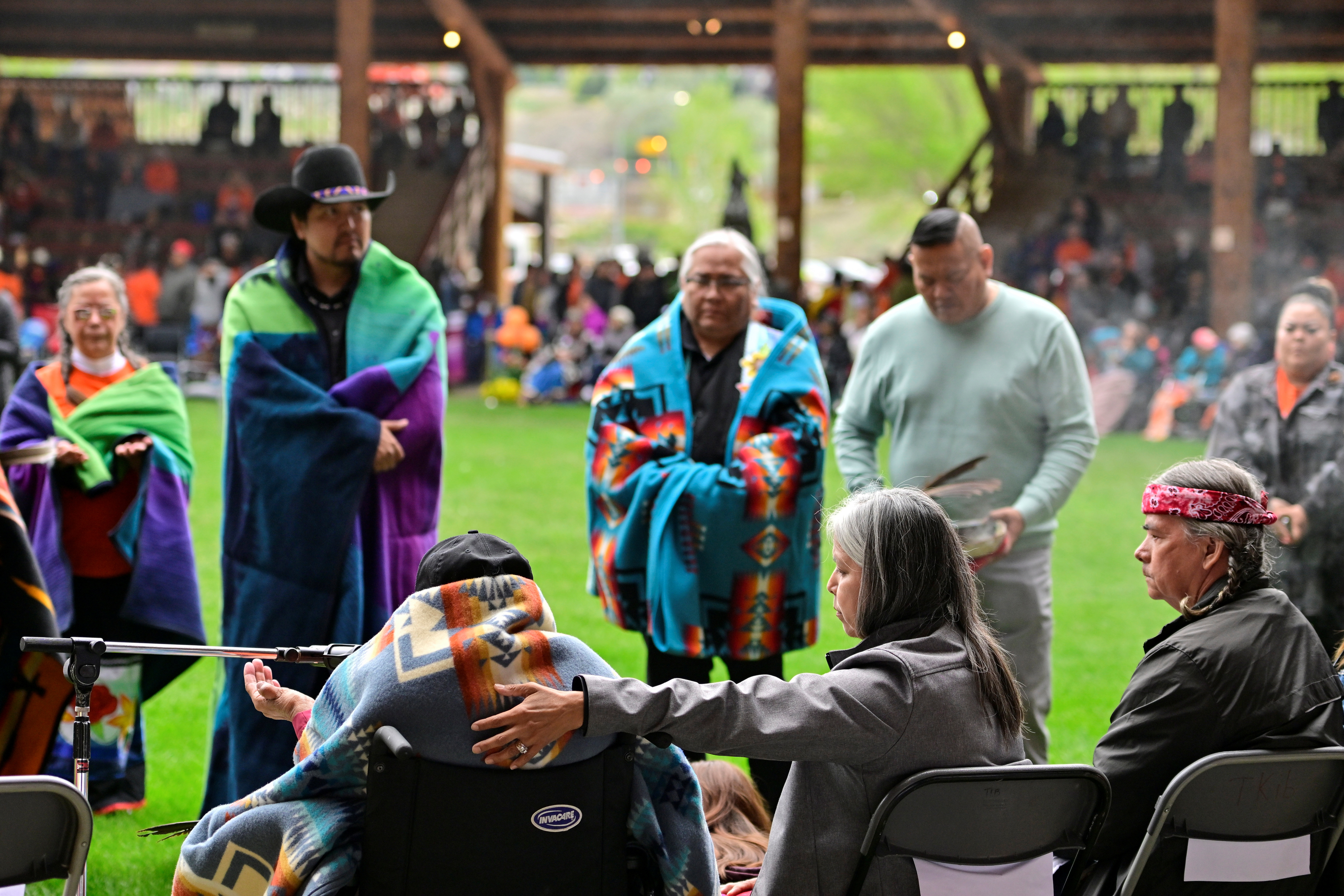 People mark the one-year anniversary of the discovery of children's remains at Kamloops Indian Residential School