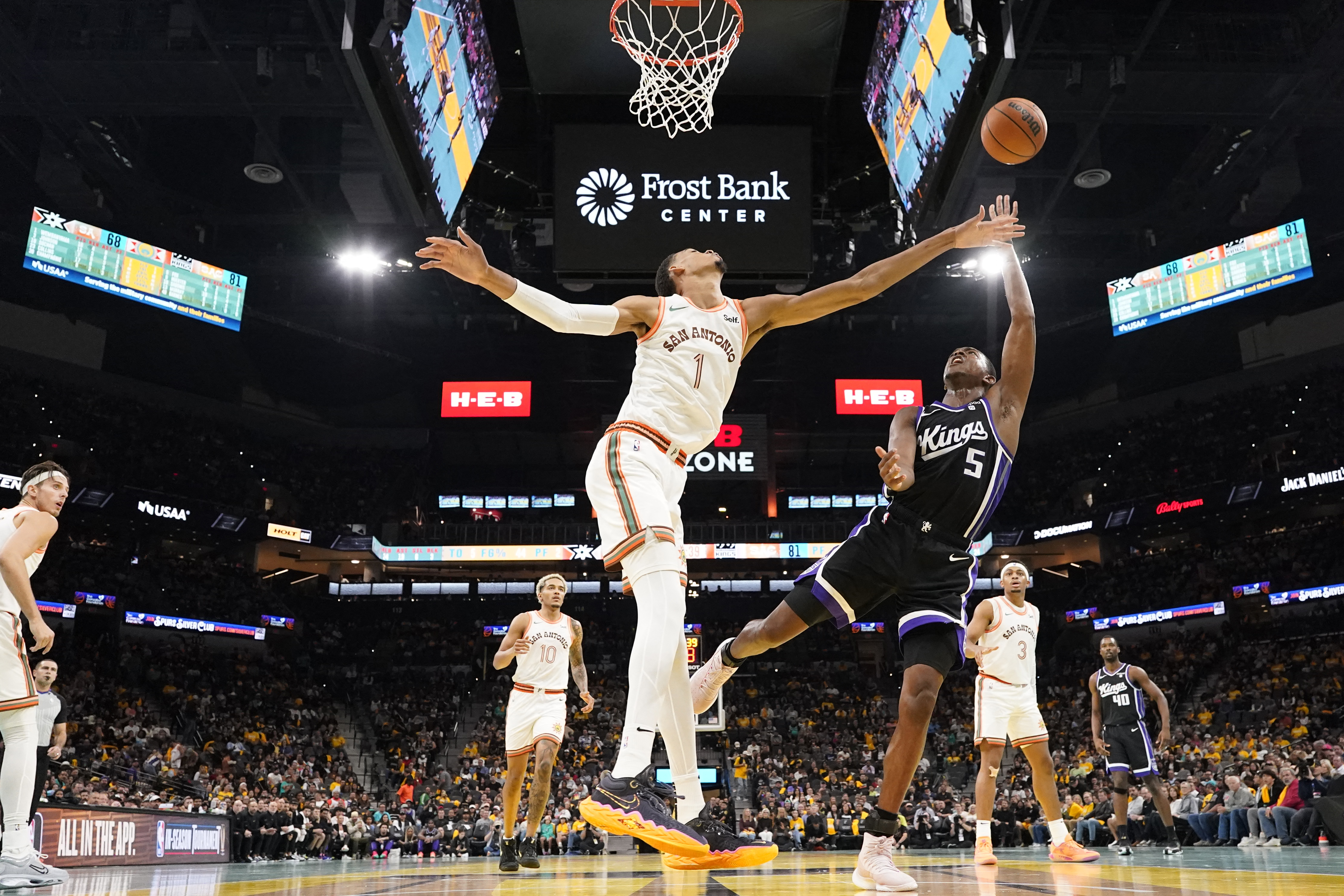 Guard De’Aaron Fox (R) will now play alongside, rather than against, Victor Wembanyama (L) and the San Antonio Spurs after being traded to the team