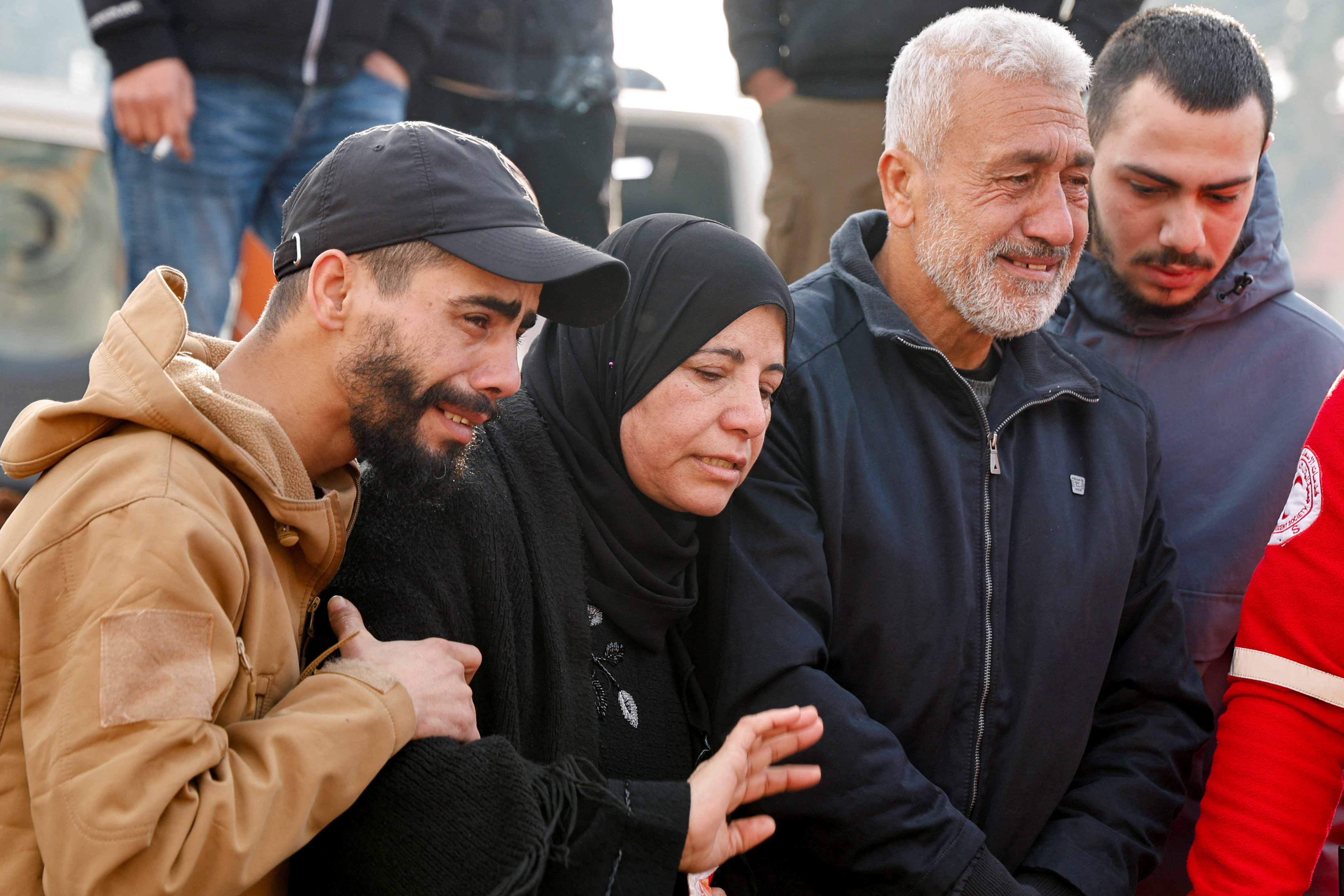 Mourners react during the funeral of Palestinians killed in an Israeli raid, in Jenin, in the Israeli-occupied West Bank