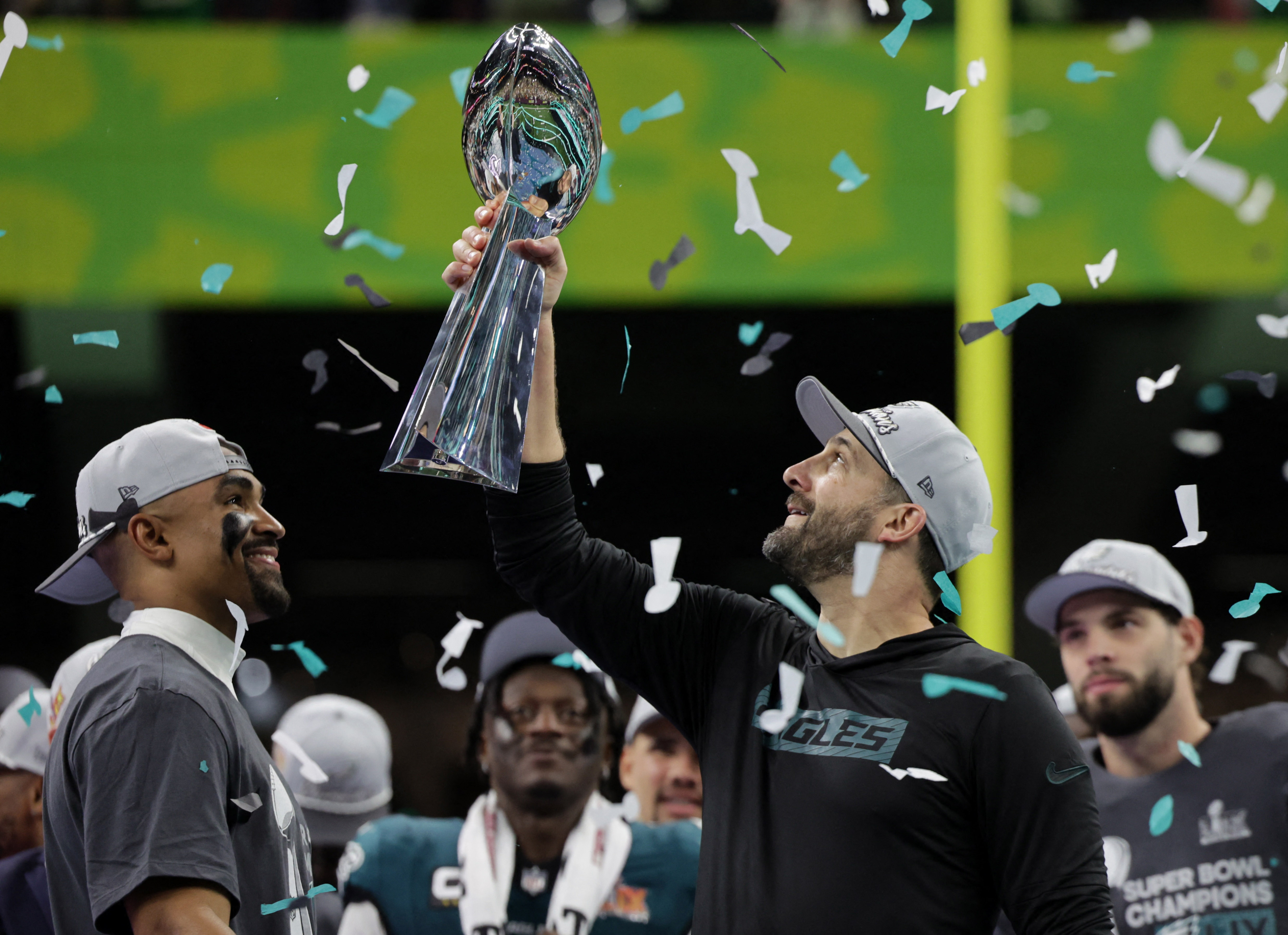 Football - NFL - Super Bowl LIX - Philadelphia Eagles v Kansas City Chiefs - Caesars Superdome, New Orleans, Louisiana, United States - February 9, 2025 Philadelphia Eagles head coach Nick Sirianni and Jalen Hurts celebrate with the Vince Lombardi Trophy after winning Super Bowl LIX REUTERS/Mike Segar