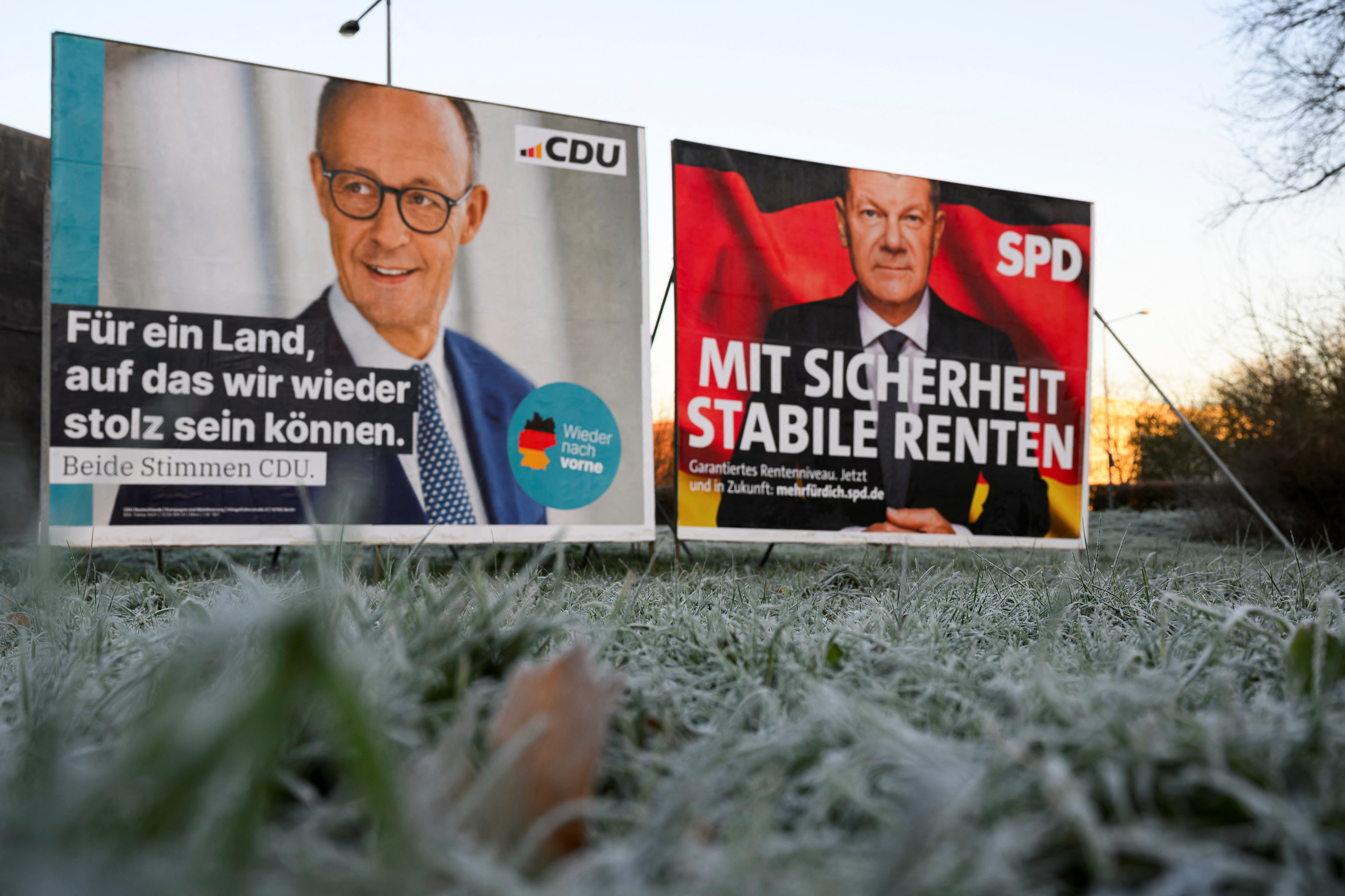 Election campaign posters for Friedrich Merz of Christian Democratic Union (CDU) and German Chancellor Olaf Scholz of Social Democratic Party Germany (SPD)