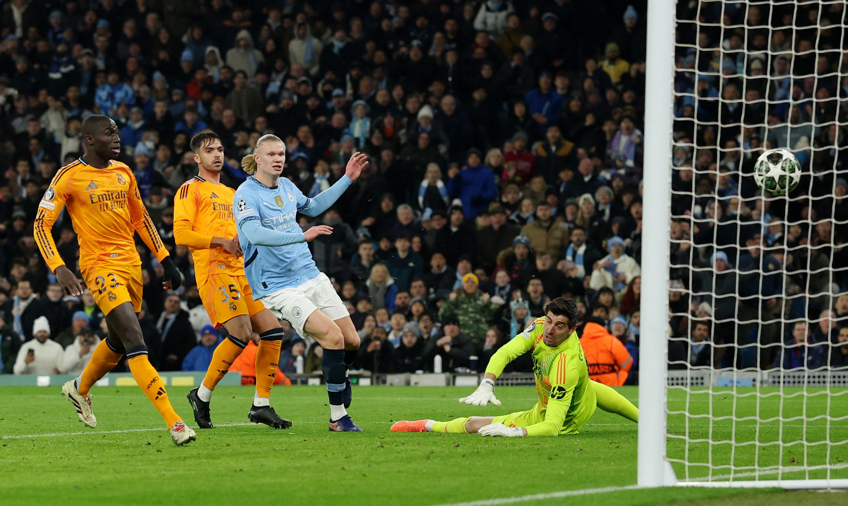 Soccer Football - Champions League - Knockout Phase Playoff - First Leg - Manchester City v Real Madrid - Etihad Stadium, Manchester, Britain - February 11, 2025 Manchester City's Erling Haaland scores their first goal REUTERS/Phil Noble