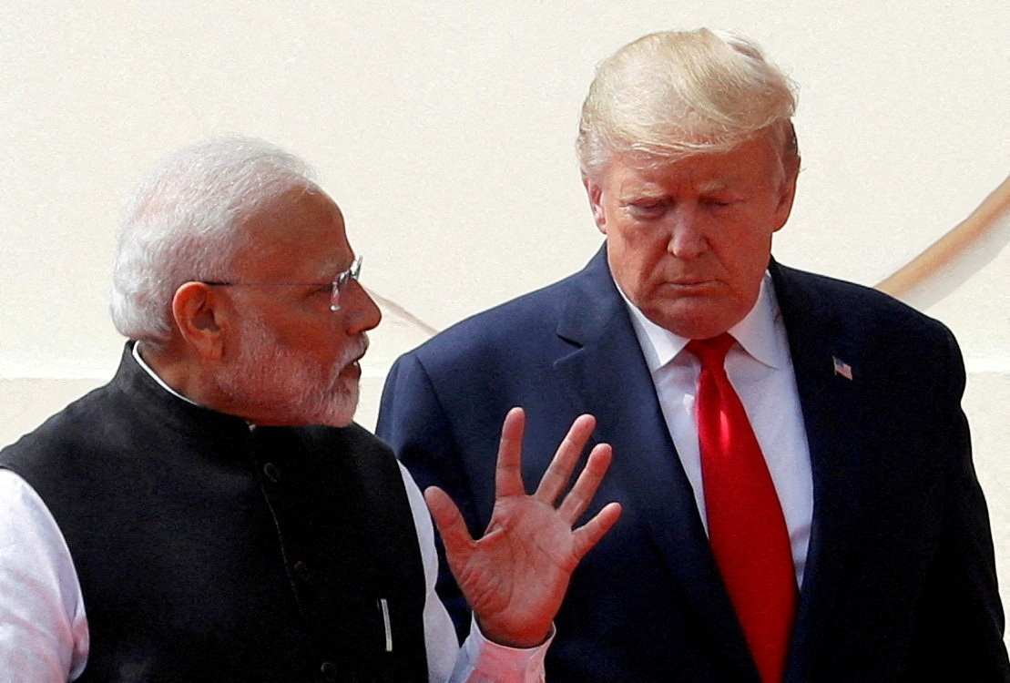 US President Donald Trump and India's Prime Minister Narendra Modi talk [File: Al Drago/Reuters]