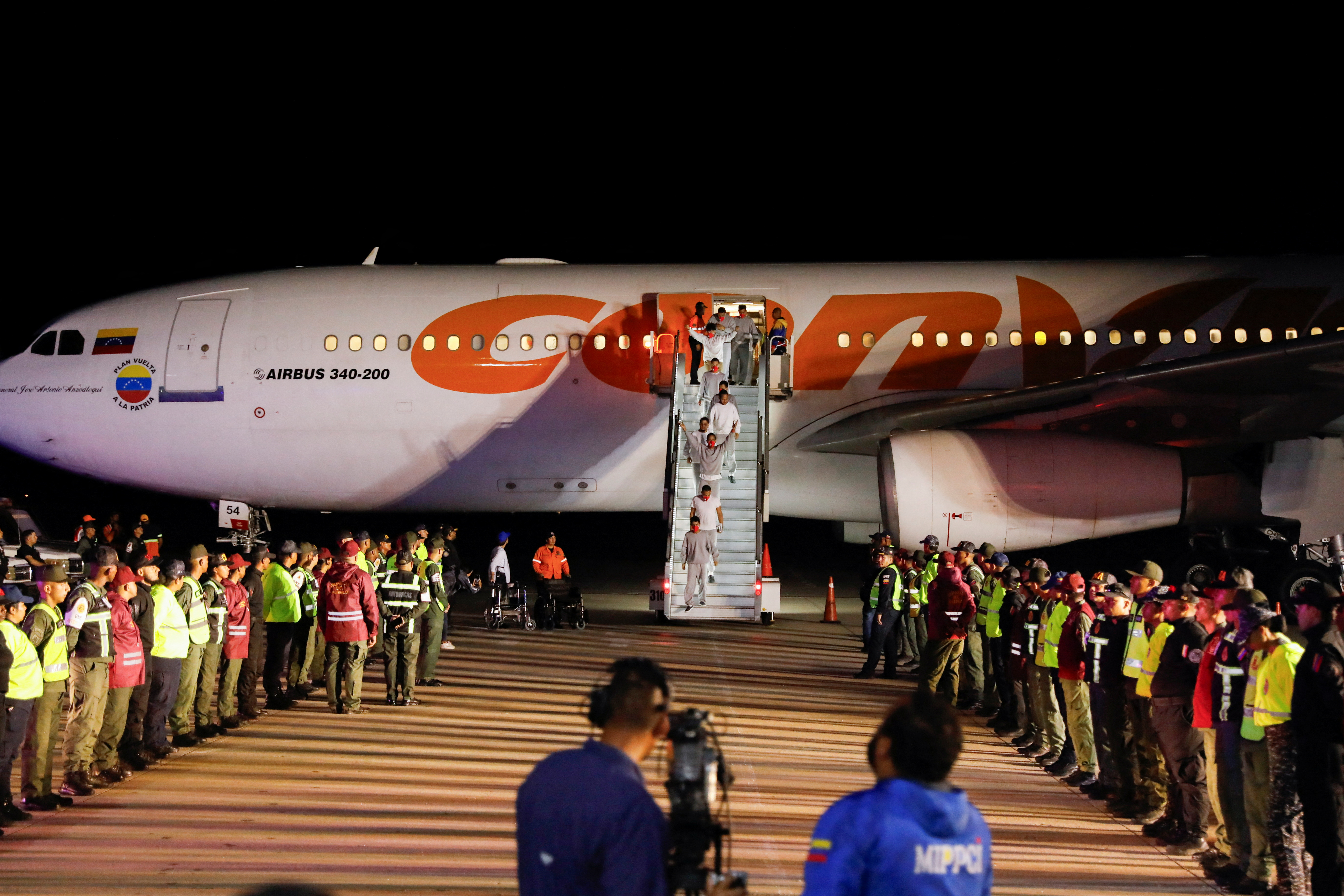 Venezuelan migrants arrive in Caracas from Guantanamo Bay