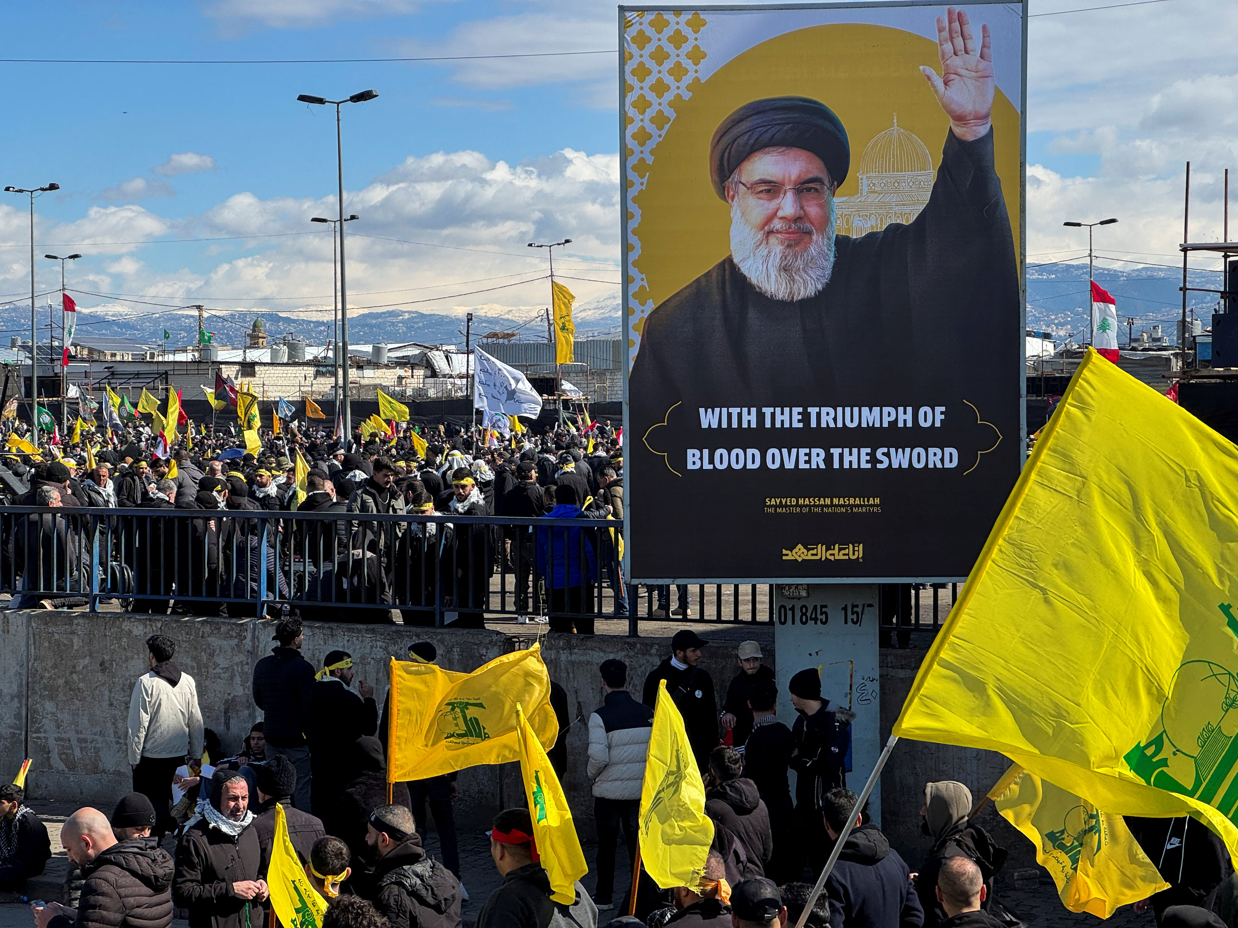 People gather during the public funeral ceremony of Hezbollah