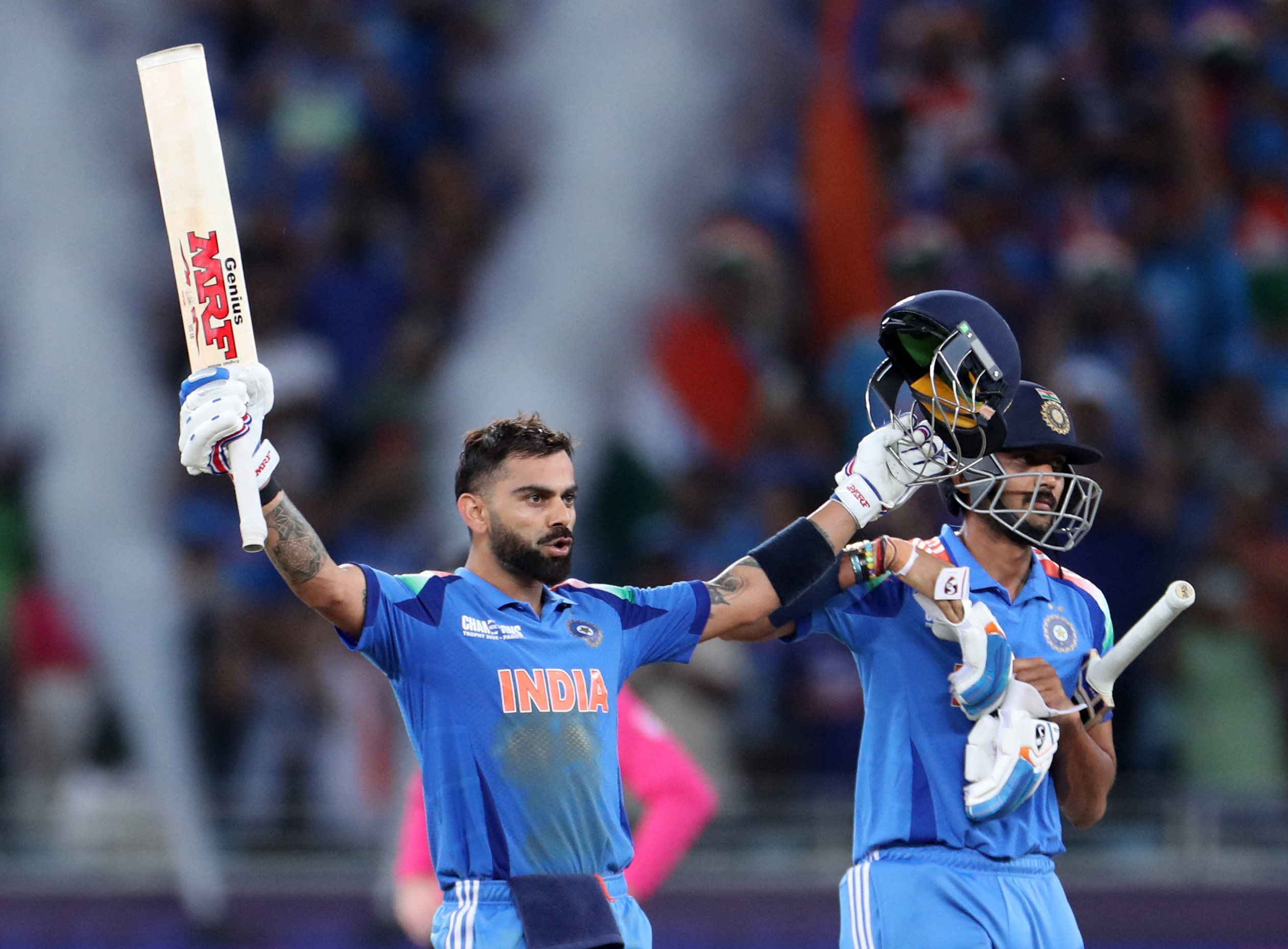 Cricket - ICC Men's Champions Trophy - Group A - India v Pakistan - Dubai International Stadium, Dubai, United Arab Emirates - February 23, 2025 India's Virat Kohli celebrates after hitting four runs to reach his century and win the match REUTERS/Satish Kumar