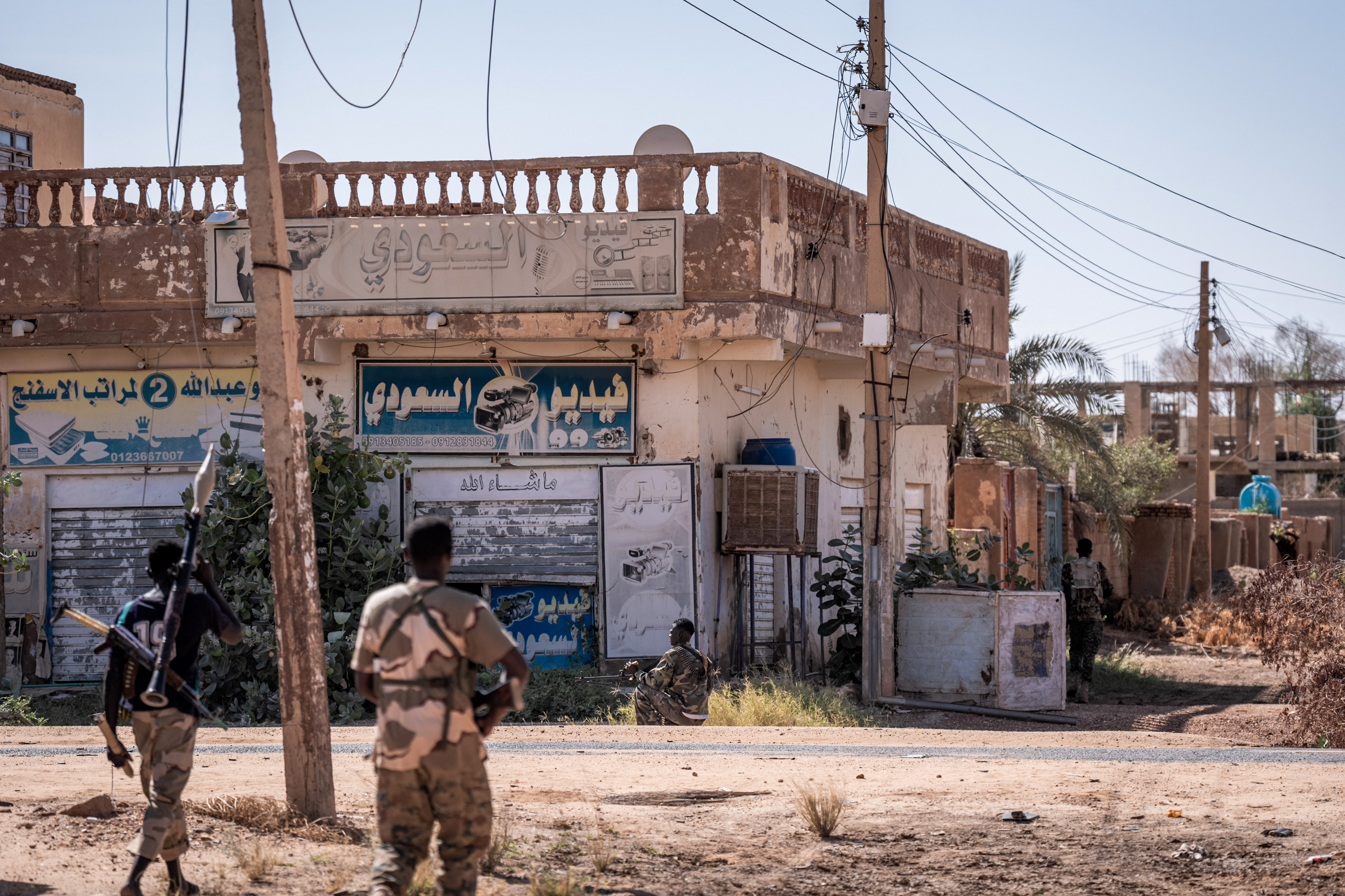 Sudanese army soldiers patrol an area in Khartoum North