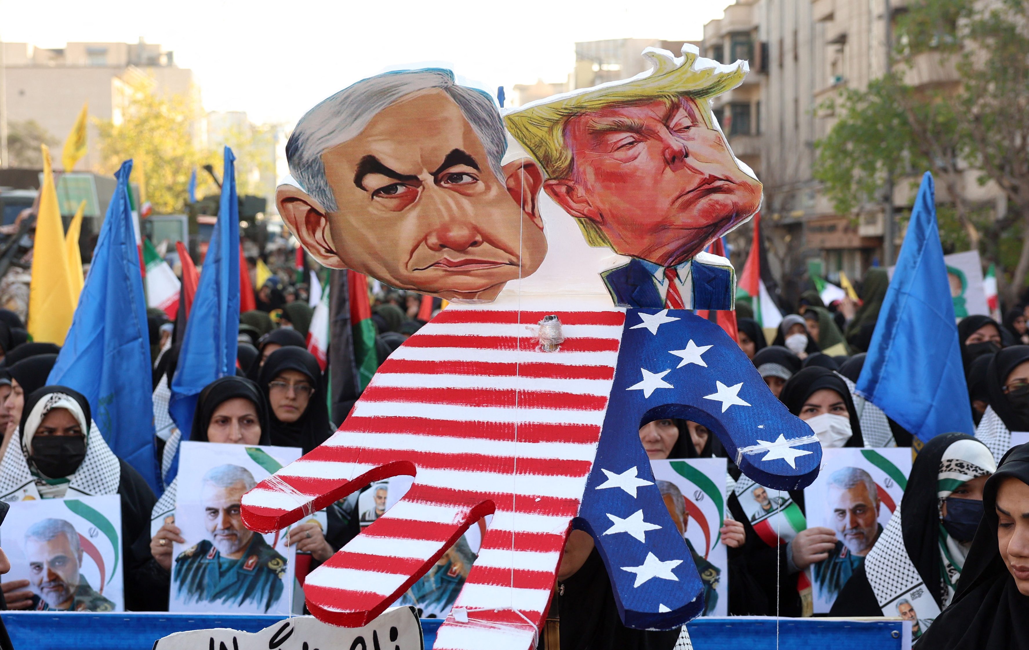 Iranian demonstrators hold effigies of Israel's Prime Minister Benjamin Netanyahu and US elect Donald Trump, during an anti-Israeli rally to show their solidarity with the Palestinian and Lebanese people, in Tehran, January 10, 2025. (Photo by AFP)