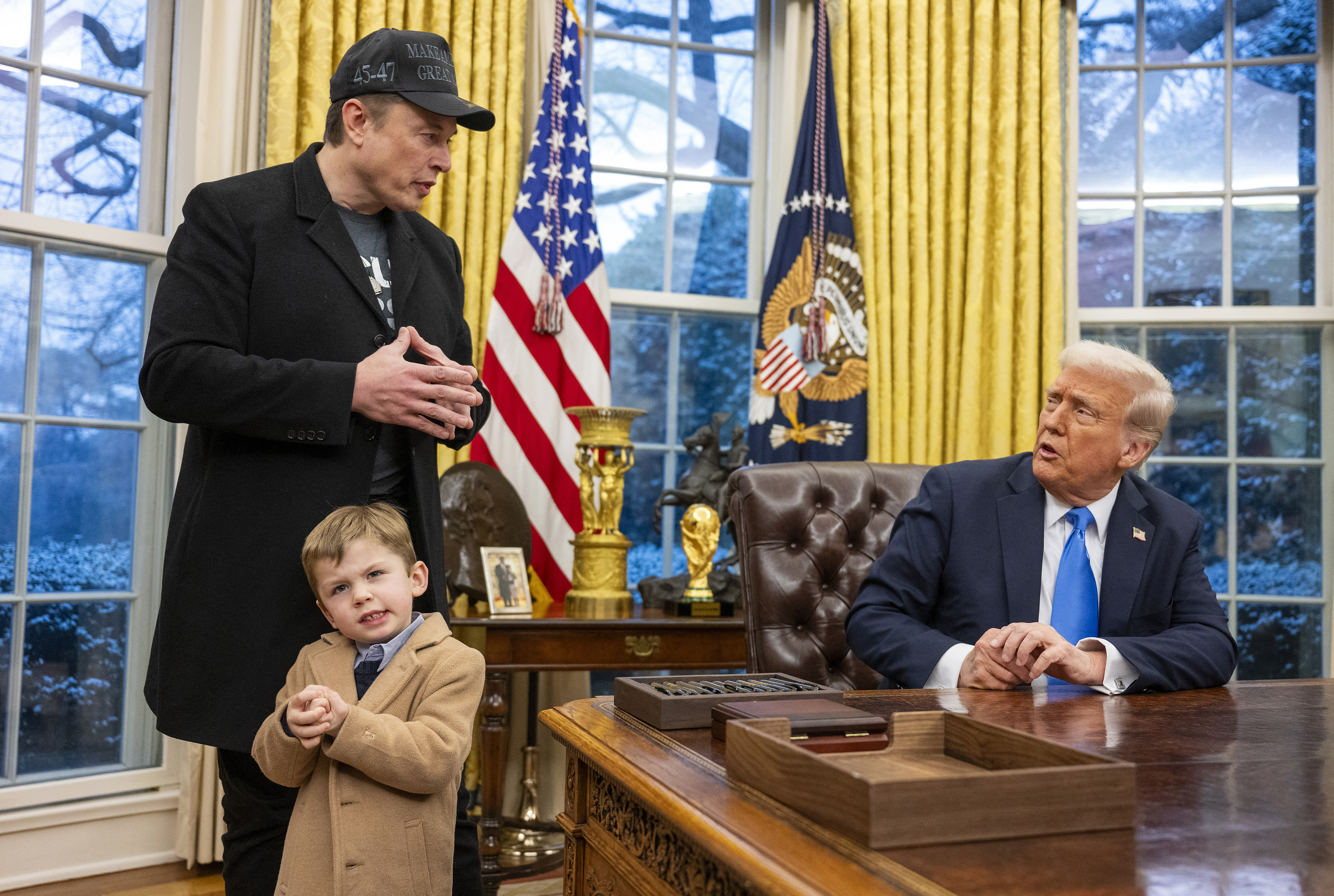 Tesla and SpaceX CEO Elon Musk with his son X Æ A-Xii join US President Donald Trump
