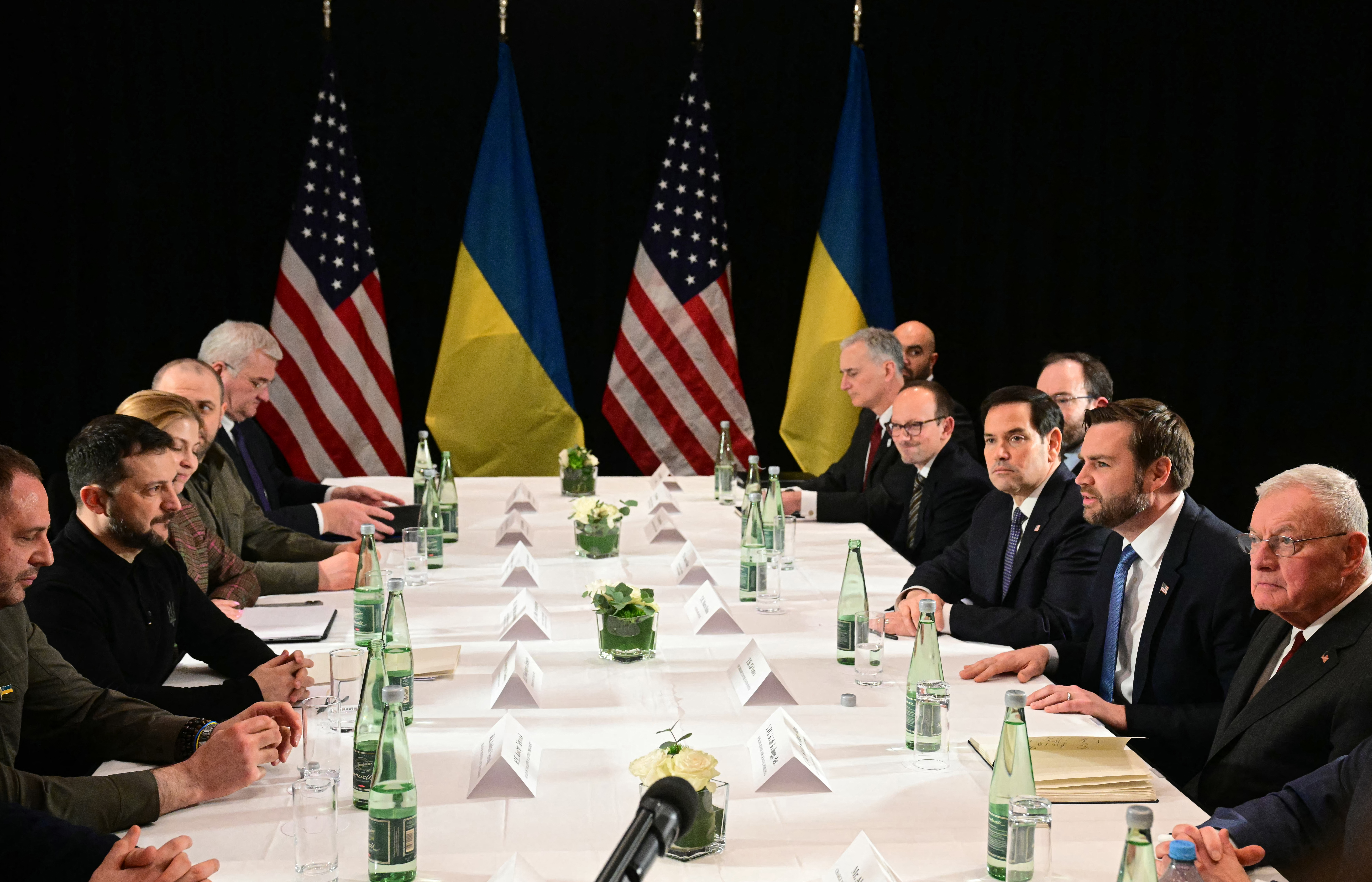 US Vice President JD Vance (2nd R), US Secretary of State Marco Rubio (3rd R) and Ukrainian President Volodymyr Zelensky (2nd L) meet on the sidelines of the 61st Munich Security Conference (MSC) in Munich, southern Germany on February 14, 2025. (Photo by Tobias SCHWARZ / AFP)