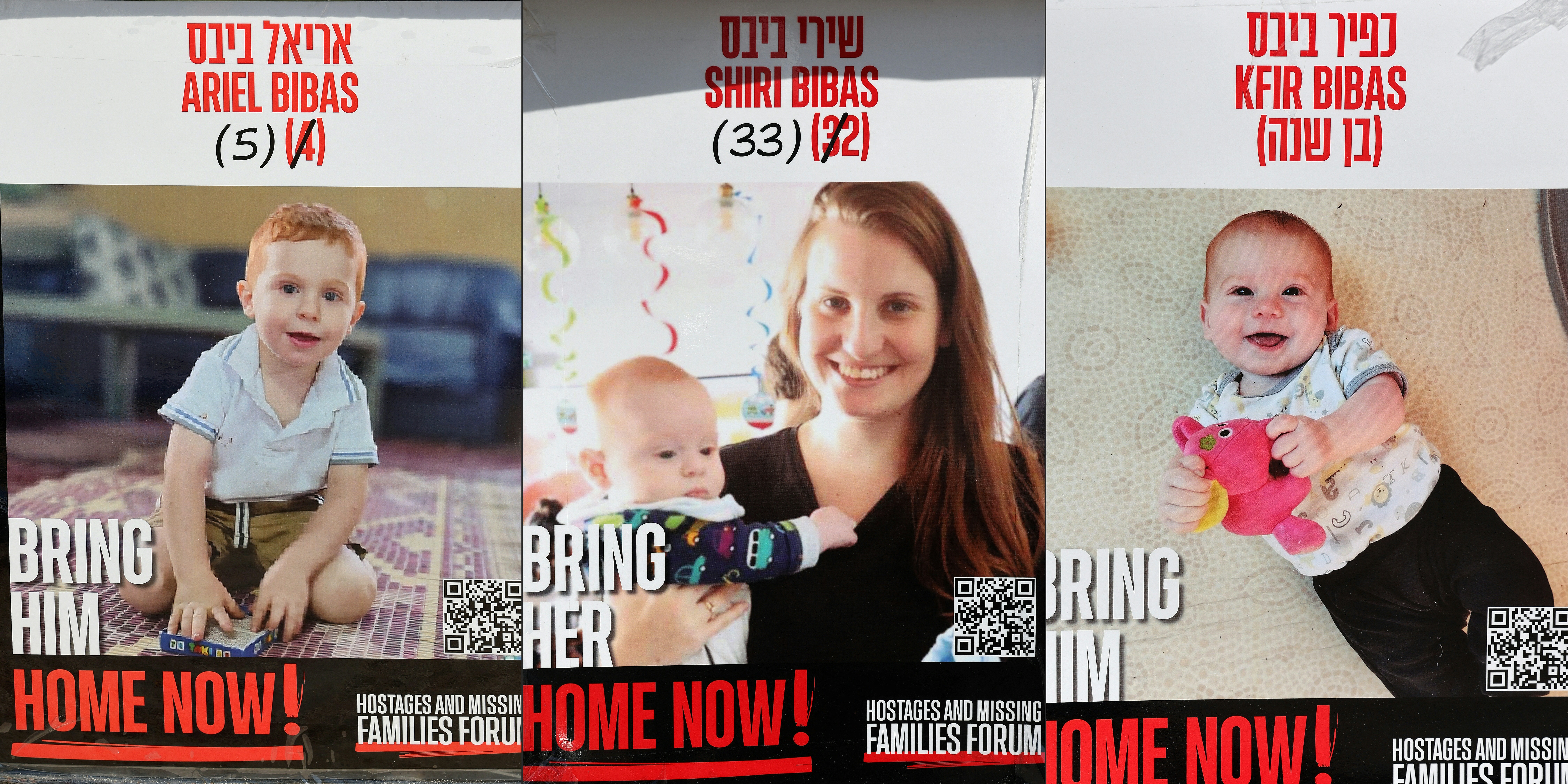 Posters bearing the portraits of Israeli captives Shiri Bibas (C) and her two children Ariel (L) and Kfir (R).