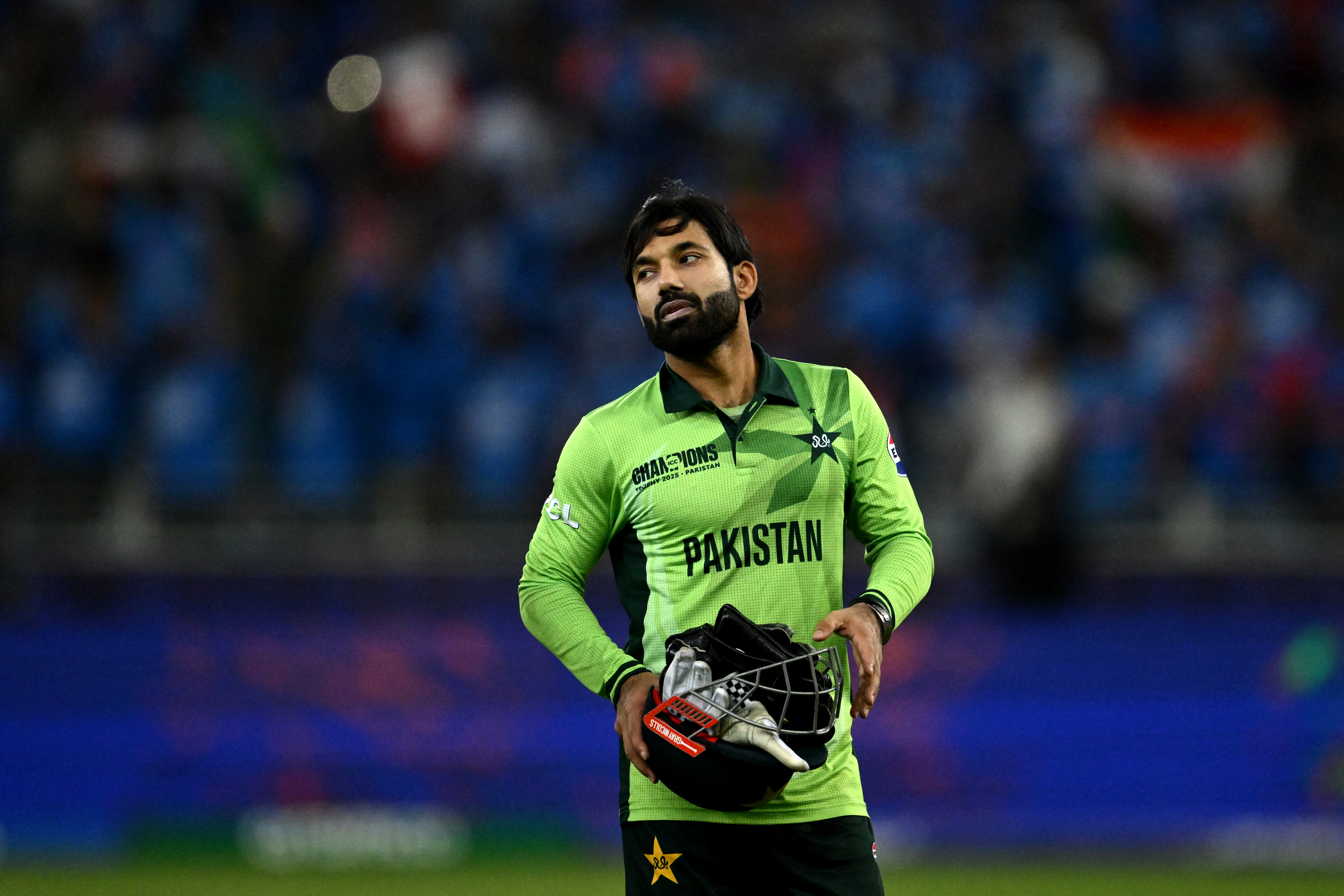 Pakistan's captain Mohammad Rizwan gestures at the end of the ICC Champions Trophy one-day international (ODI) cricket match between Pakistan and India at the Dubai International Stadium in Dubai on February 23, 2025. (Photo by Jewel SAMAD / AFP)