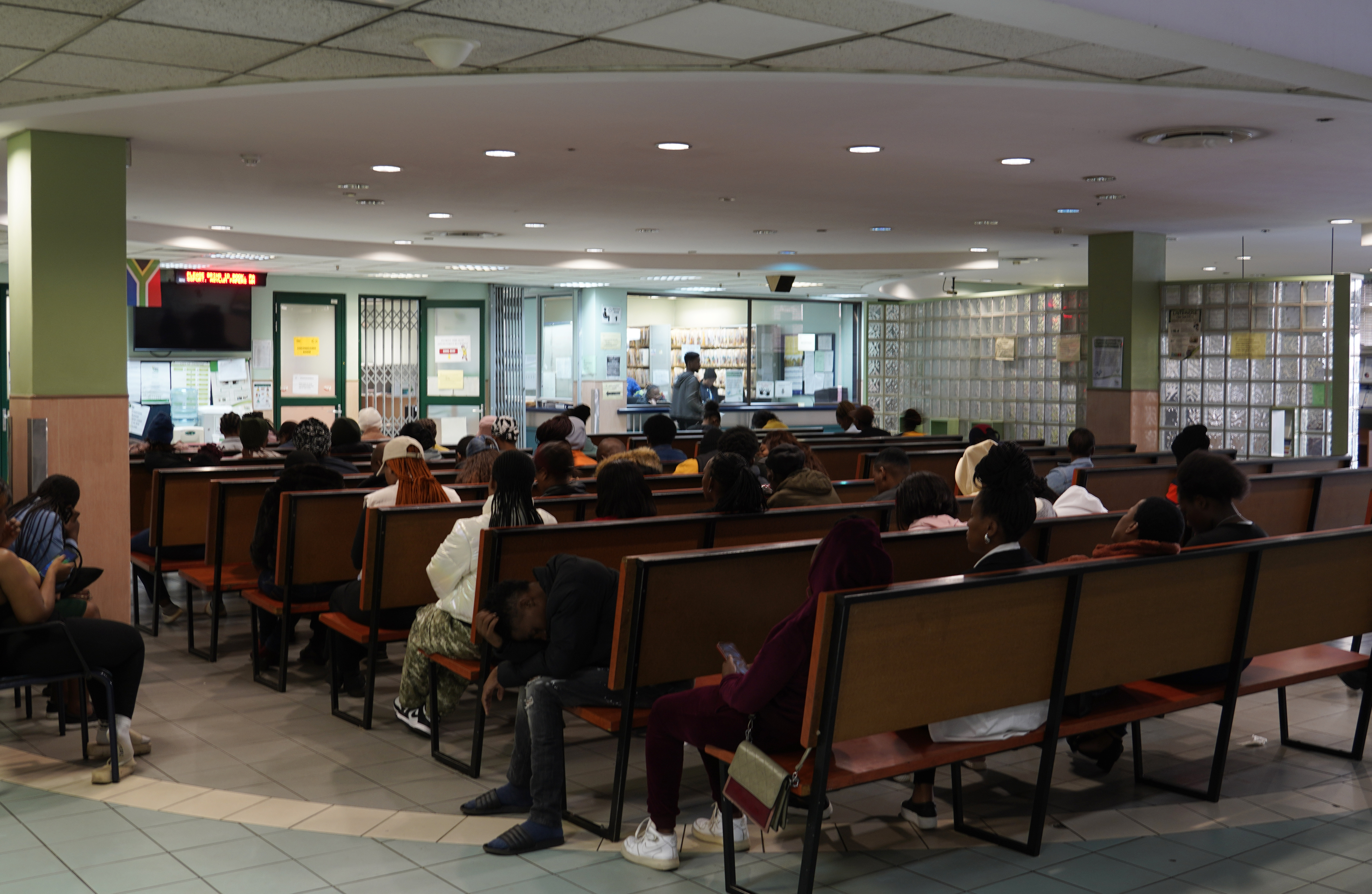 People queue at a health clinic