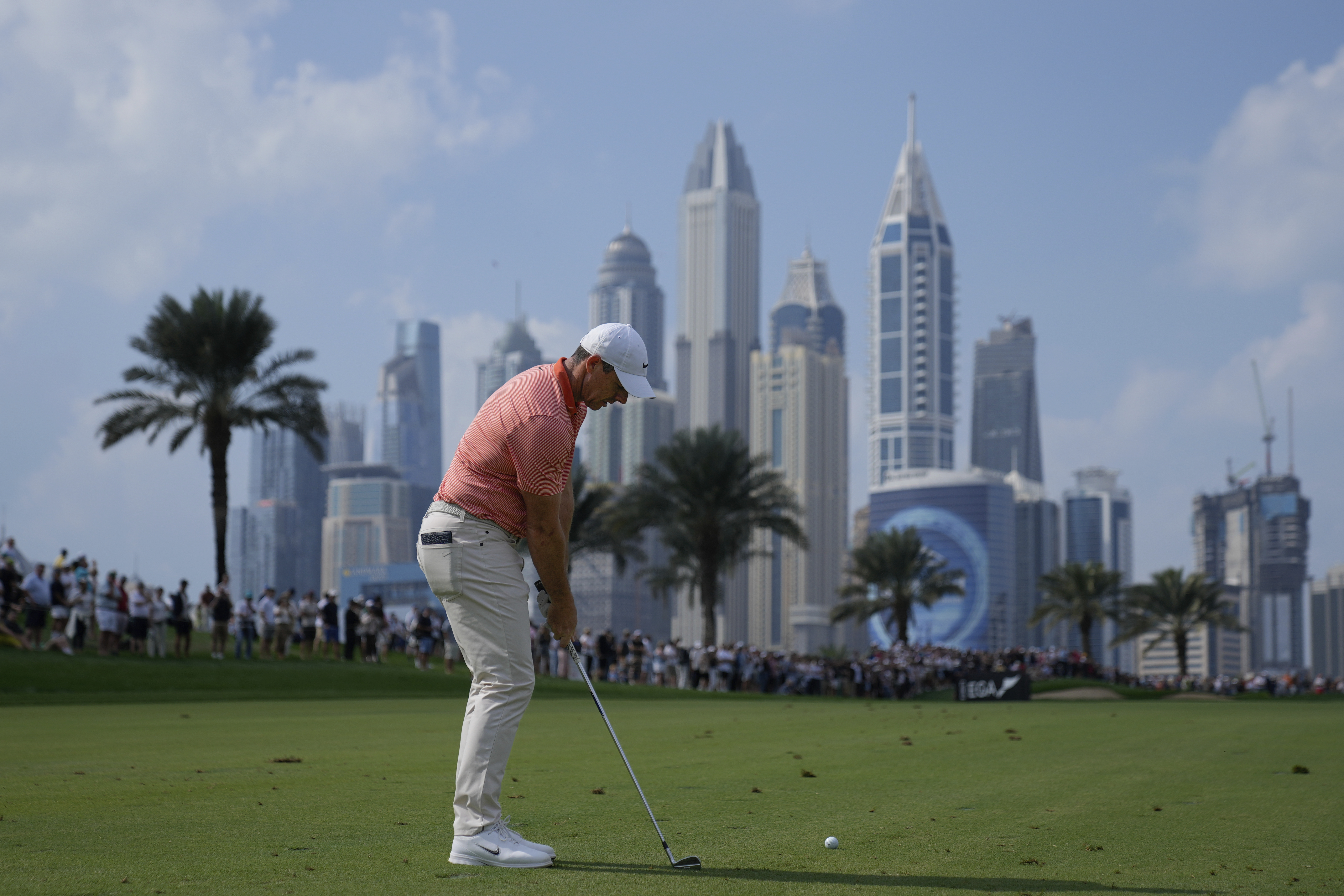 Rory McIlroy of Northern Ireland prepares to play his second shot on the 8th hole during the final round of the Dubai Desert Classic golf tournament, in Dubai, United Arab Emirates, Sunday, Jan. 19, 2025. (AP Photo/Altaf Qadri)